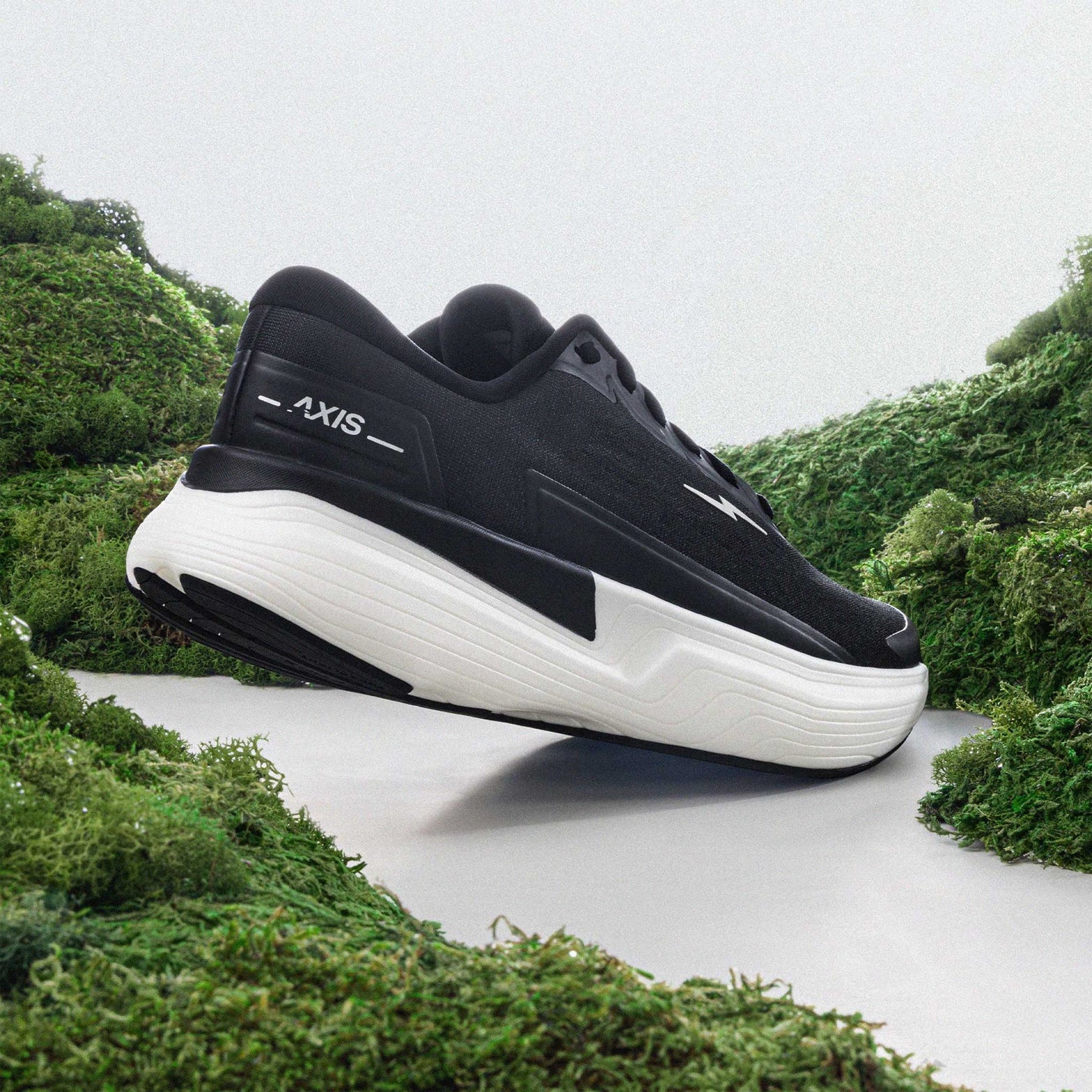Hylo AXIS Running Shoes Black Undyed heel view showing PureGlide SP sculpted midsole geometry with corn-derived collar and maximum cushioning construction