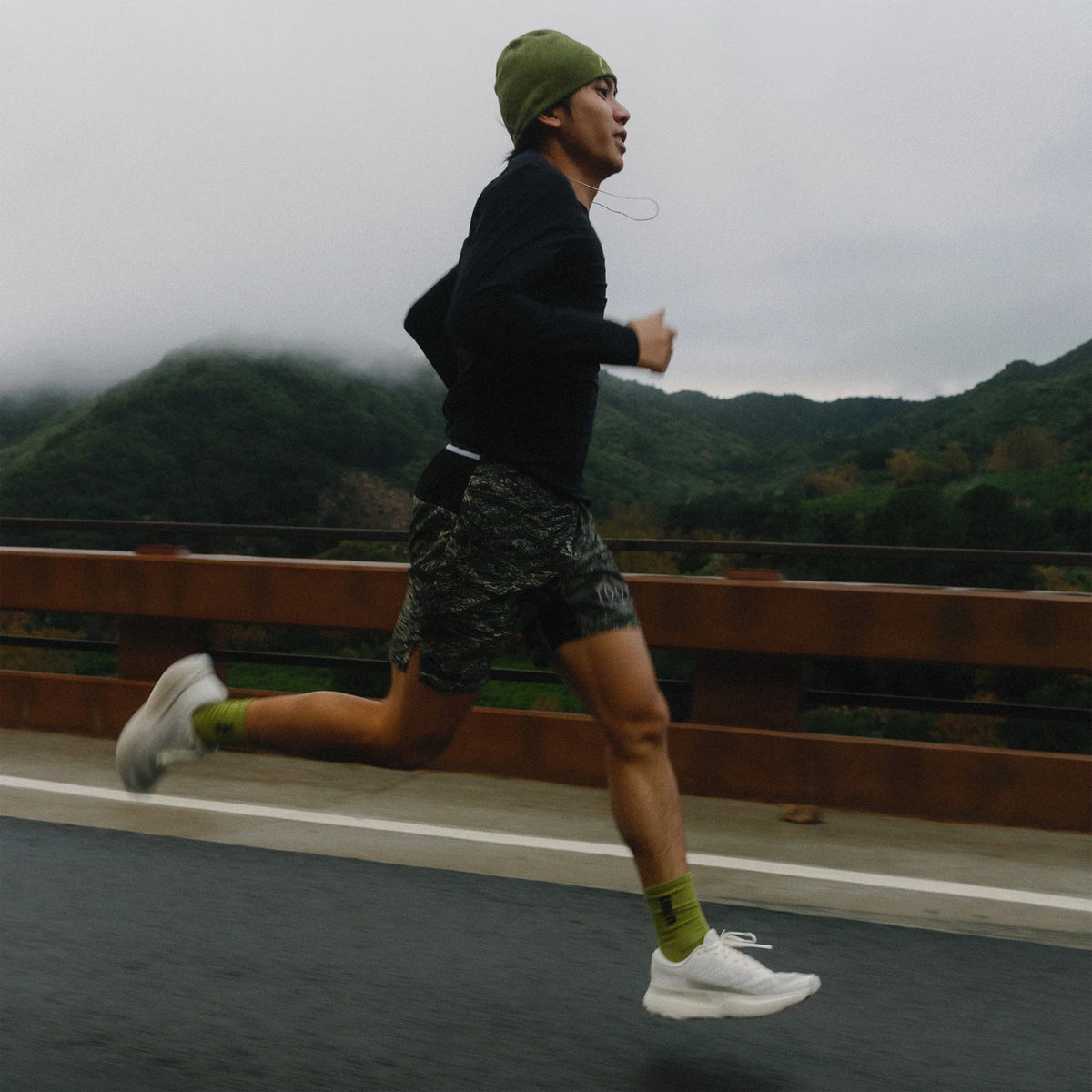 Hylo AXIS Running Shoes White Grey worn by runner in motion showing 38mm stack bio-based Hyperbolt foam, smooth heel-to-toe transition and sustainable maximum cushioning performance