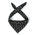 Satisfy Carré de Soie SoftCell™ Bandana in Jet Black — worn bound as a neck scarf showing SoftCell™ silk drape, fluid movement and all-over Satisfy logo print