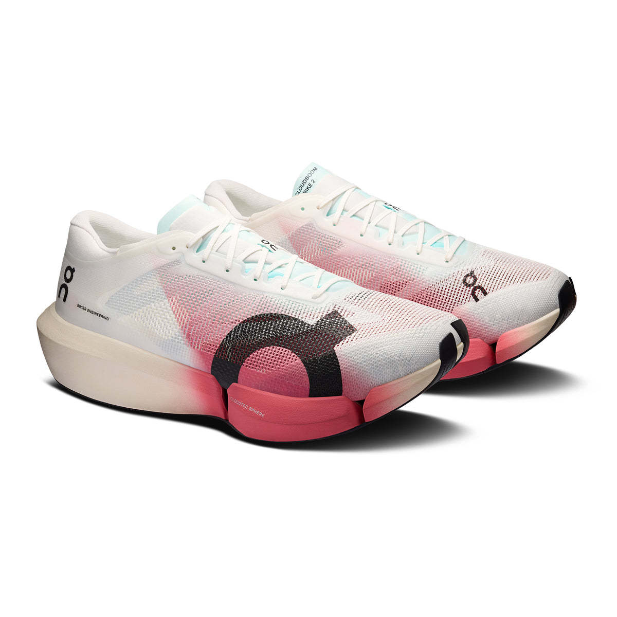 A pair of white and pink athletic running shoes with a thick sole and black On logo on the side. The shoes have a mesh design and blue laces.
