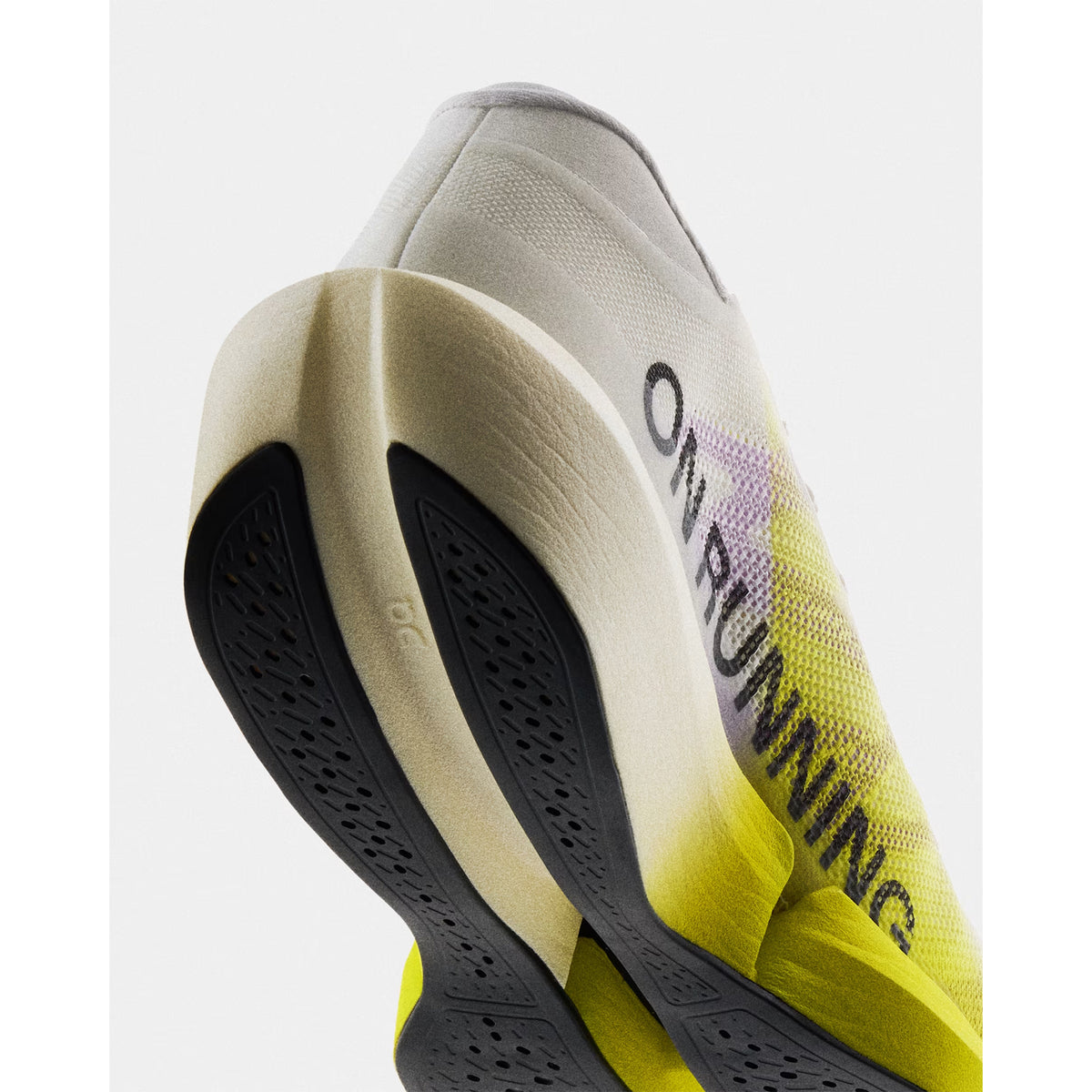On Cloudboom Strike 2 White Lime angled side and heel view showing CloudTec Sphere cushioning with Helion HF foam, removable top midsole and carbon Speedboard for athlete-tested marathon race day performanc