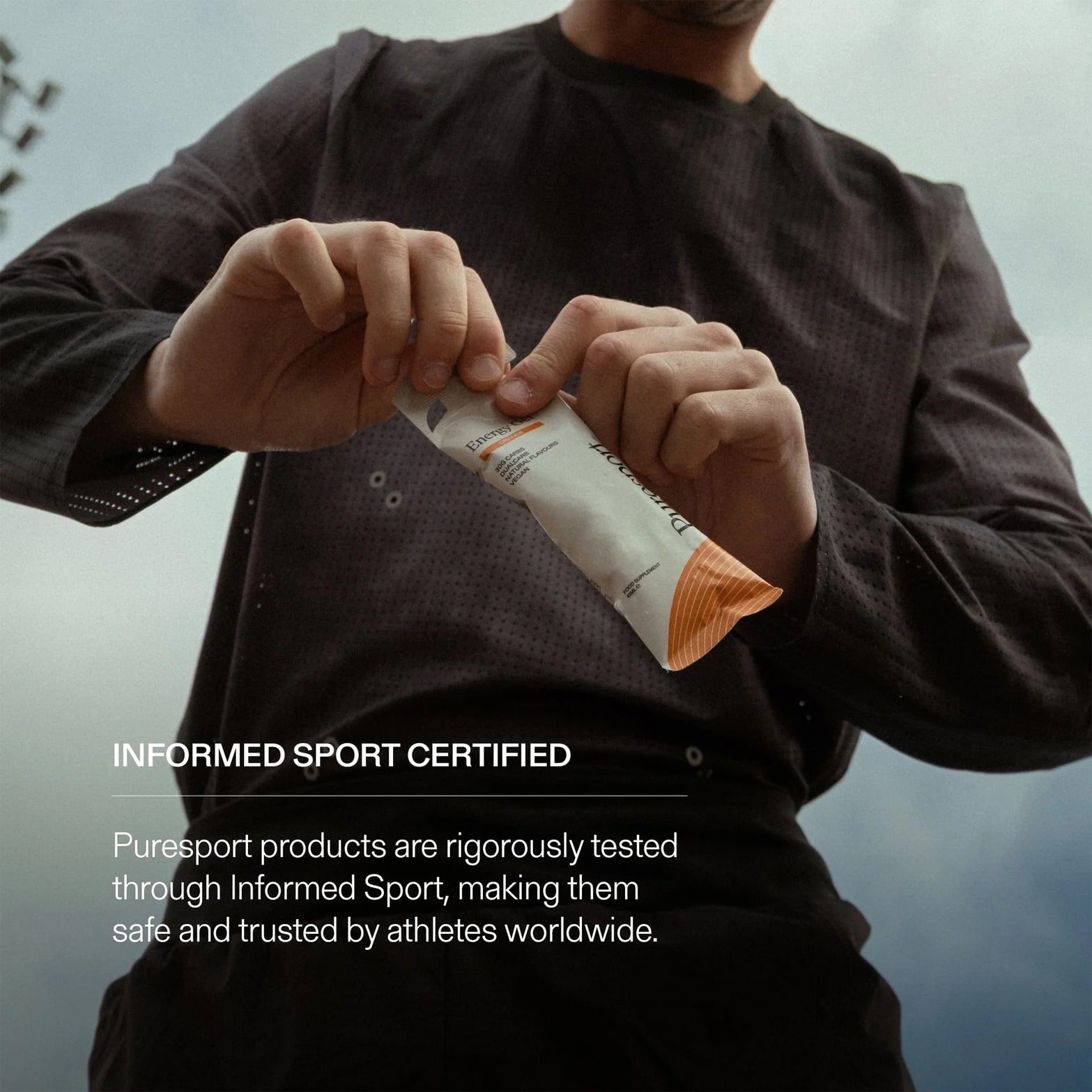 Puresport Energy Gel Orange — action shot showing energy gel being consumed during run