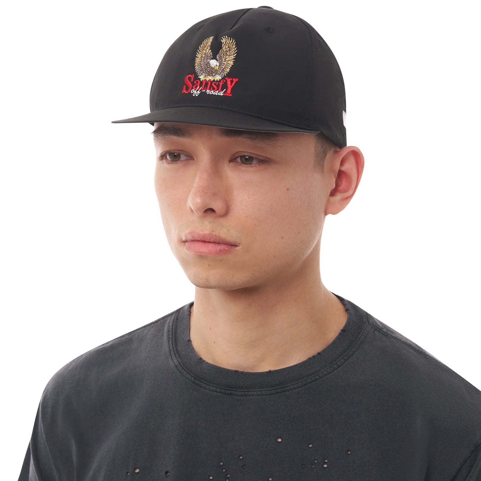 Satisfy FliteSilk™ 5 Panel Pinch Cap in Black Eagle — front view worn on model showing five-panel pinch fit, short brim and black FliteSilk™ Italian nylon with Satisfy embroidery