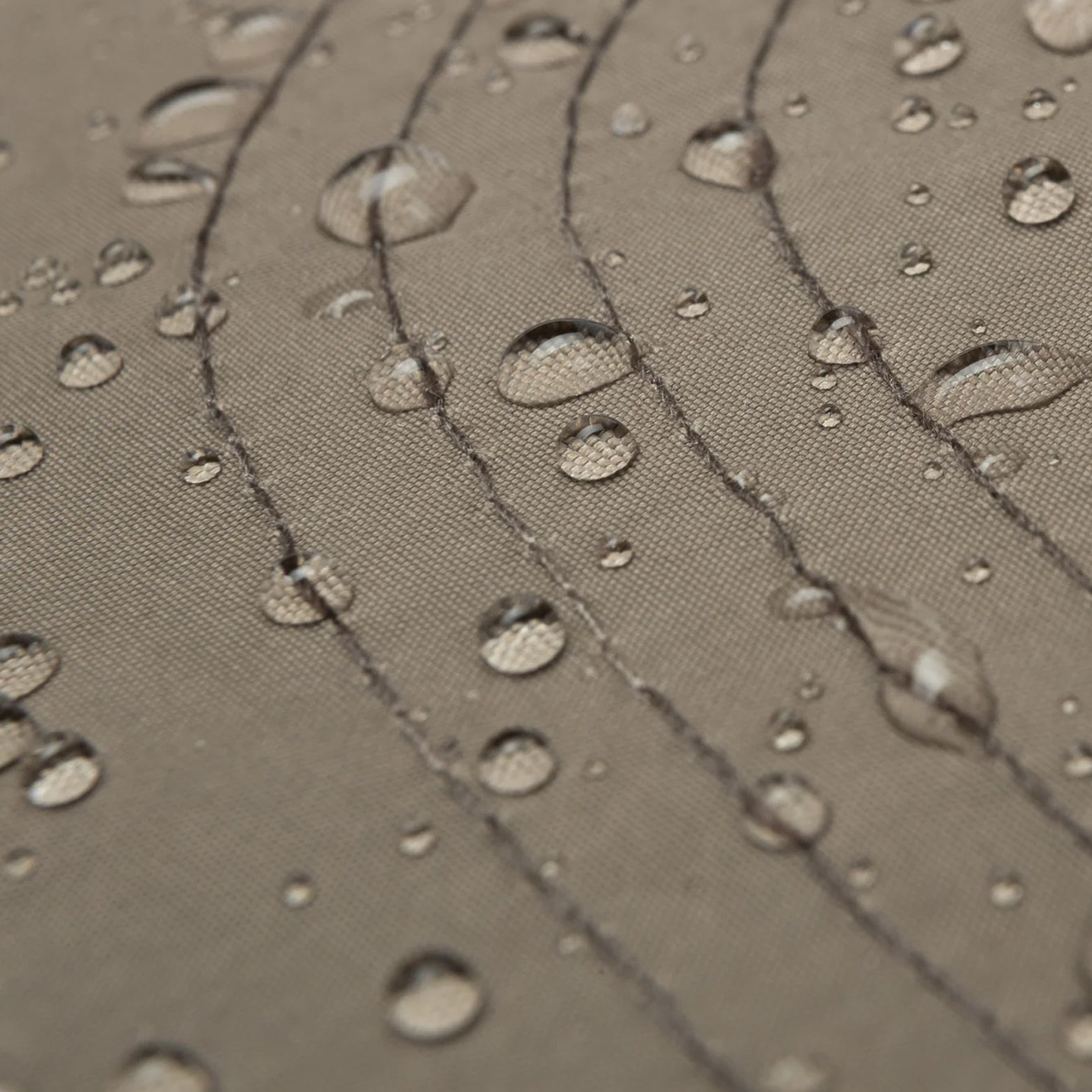 Satisfy FliteSilk™ 5 Panel Pinch Cap in Falcon Embroidery — closeup showing water-repellent FliteSilk™ Italian nylon fabric texture with water droplets demonstrating wind and water-repellent properties