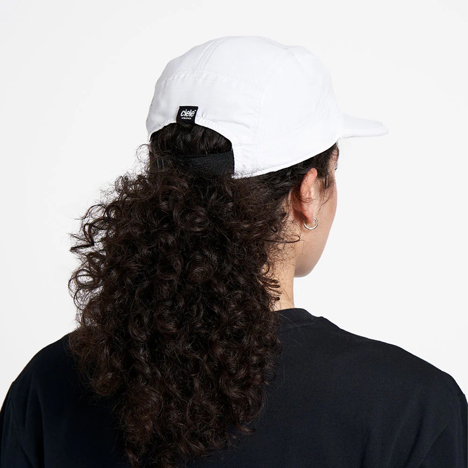 Ciele GOCap Classic Athletics Ghost back view on runner showing adjustable rear closure with reflective elements for low-light visibility during running