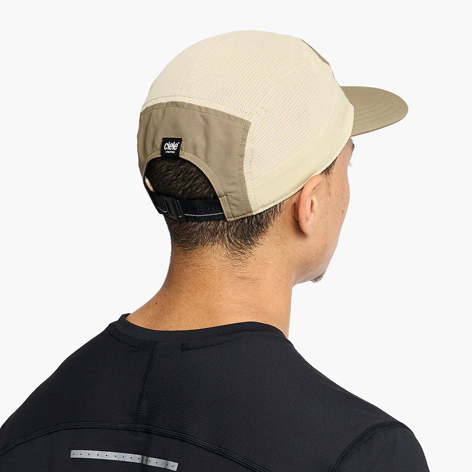 Ciele GOCap Comp Century Canvas Safari back view on runner showing reflective detailing for night run visibility with fast-drying mesh construction