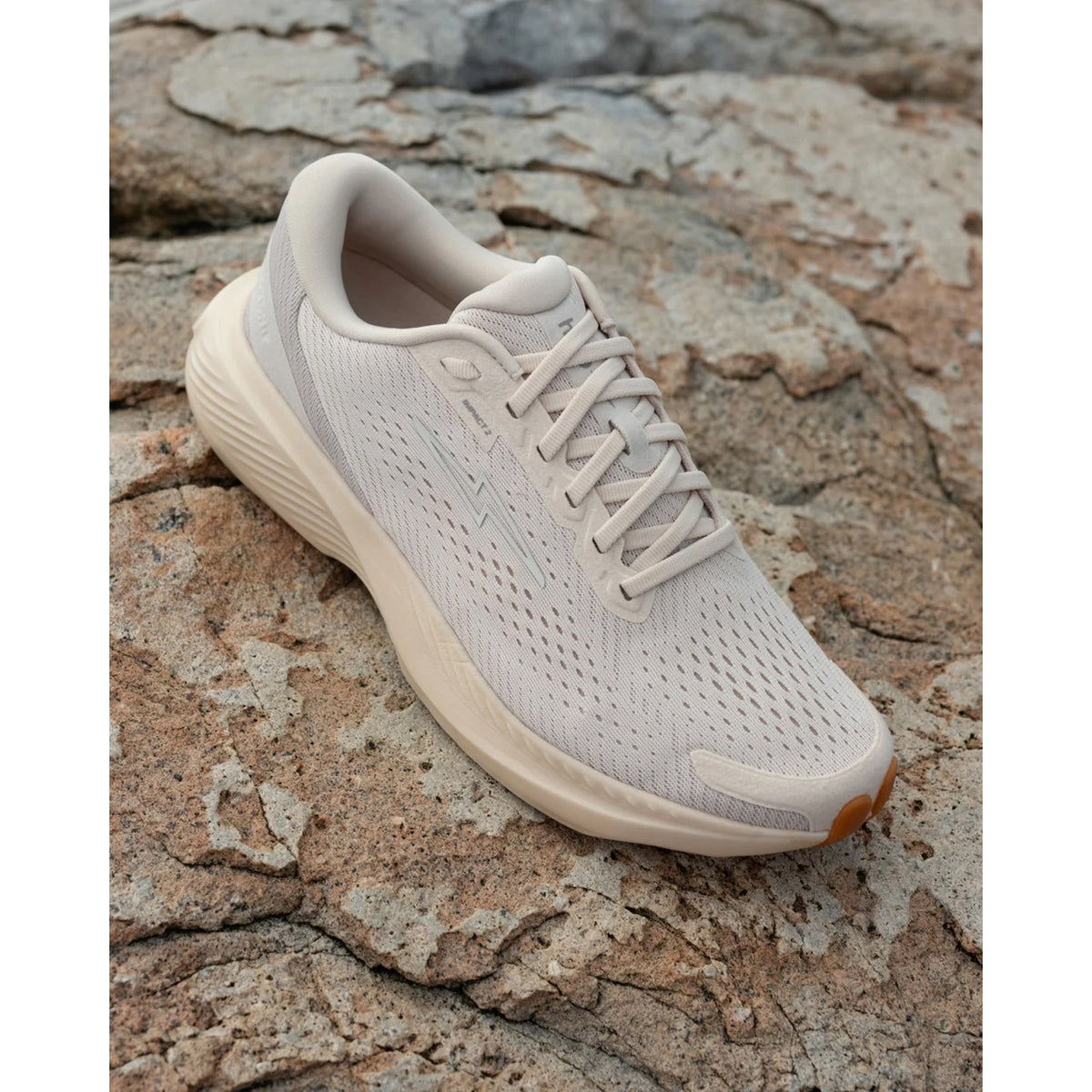 Hylo Impact 2 Running Shoes Sand Oat lifestyle shot showing outer side with HyperBolt+ bio-based foam midsole and TreadLight natural rubber outsole in everyday wear setting