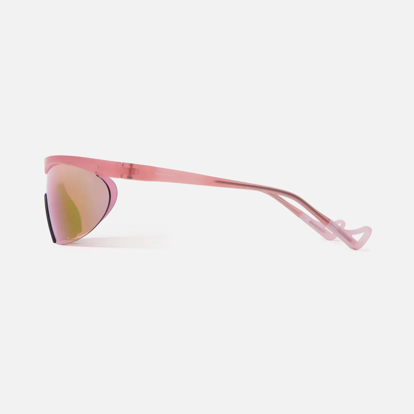 District Vision Koharu Eclipse in Desert Rose D+ Aqua Mirror — side product shot showing 125mm helmet-compatible temple, grade 2 titanium core detail and desert rose frame profile with D+ Aqua Mirror lens