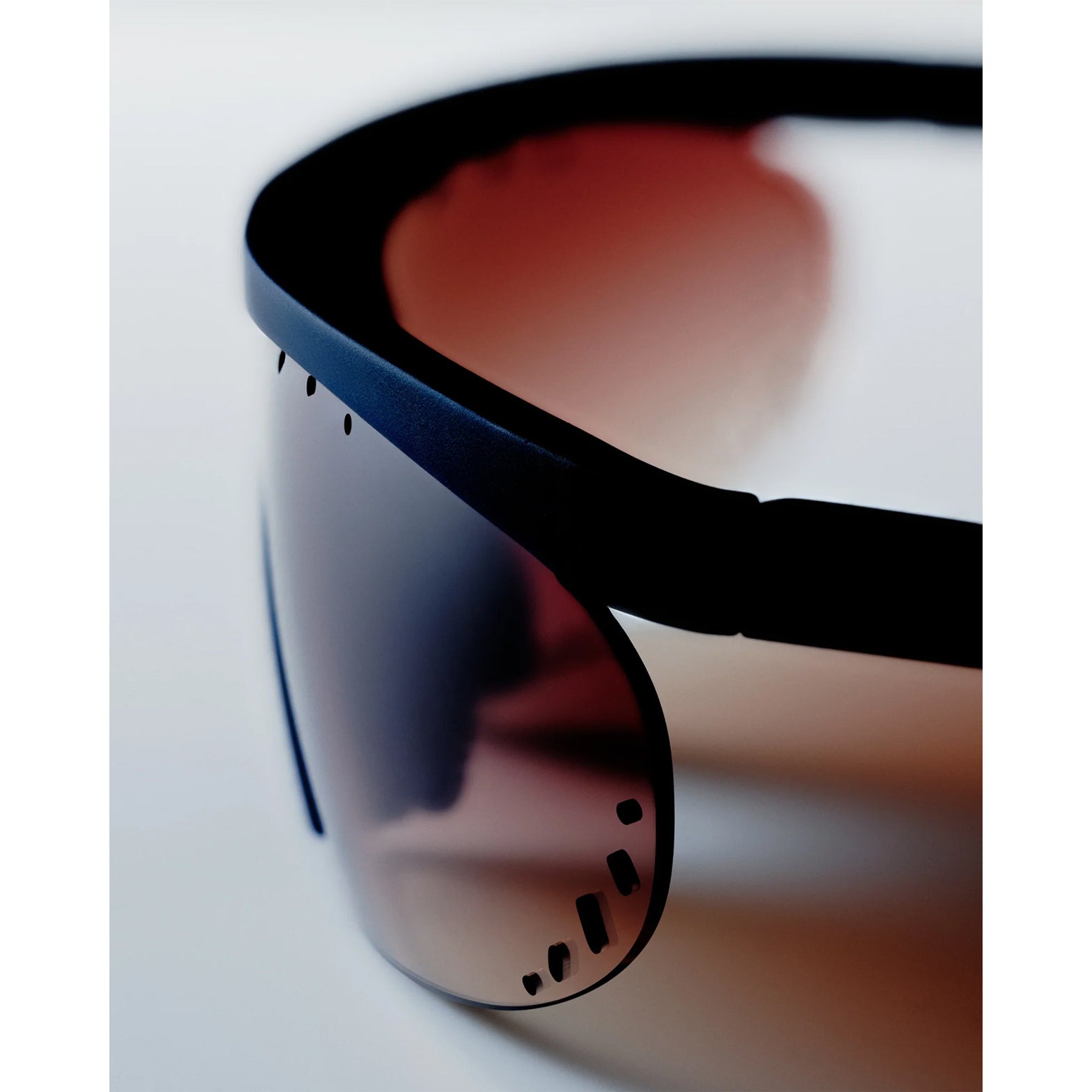 District Vision x PAF Koharu Eclipse in Deep Sea D+ Brown Gradient — closeup showing six-base blade-style frame profile, grade 2 titanium core temple tip construction and deep sea colourway with integrated ventilation detail