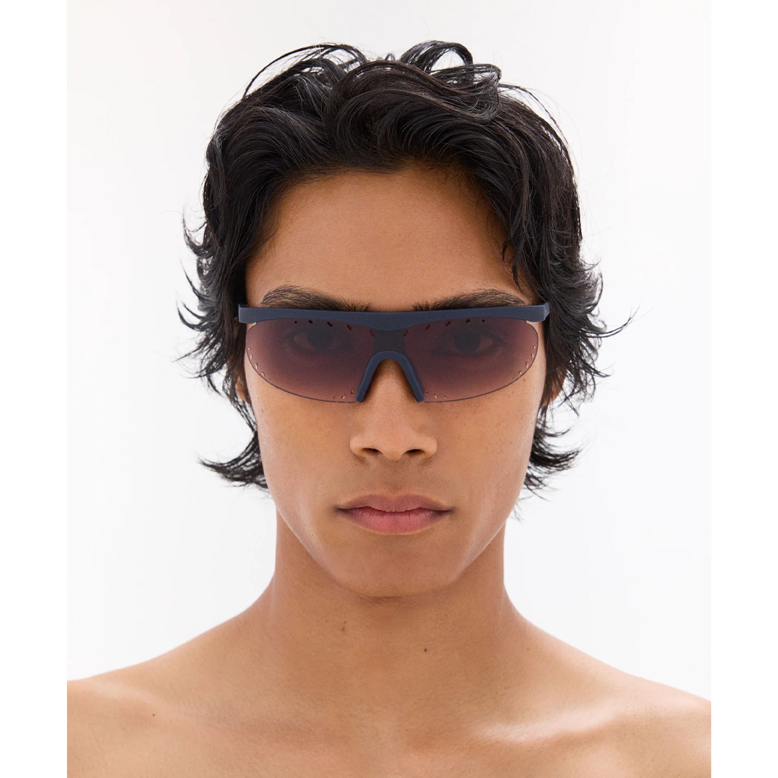 District Vision x PAF Koharu Eclipse in Deep Sea D+ Brown Gradient — worn on male model showing six-base blade-style frame fit, deep sea colourway and D+ Brown Gradient lens in natural light