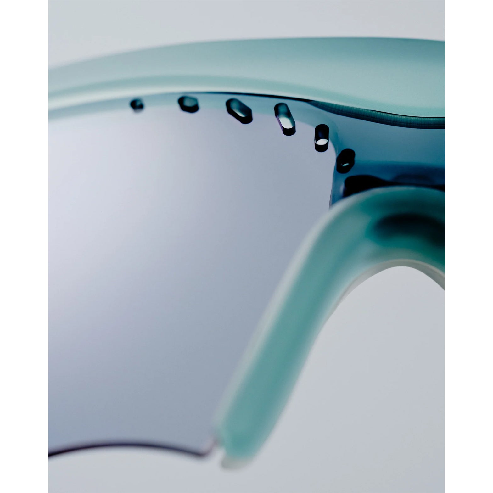 District Vision x PAF Koharu Eclipse in Lichen D+ Sports Gray — closeup showing  integrated ventilation detail and D+ Sports Gray therapeutic-grade polycarbonate construction on lichen frame