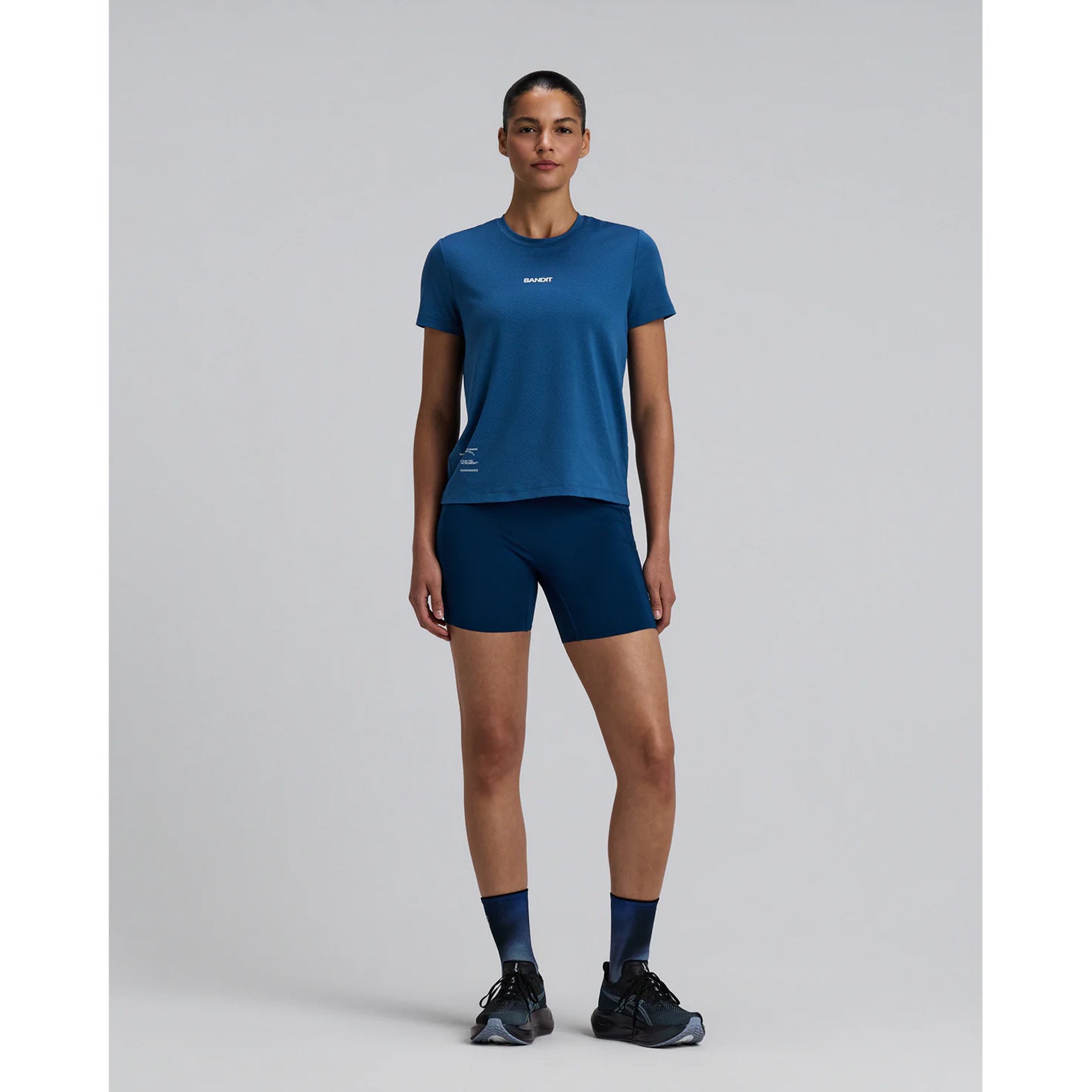 Bandit Lite Run™ Quarter Socks 2 Pack in Flow State Aegean Multi — full body front view worn on model showing quarter-length cut and flow state aegean multi ribbed detail with running kit