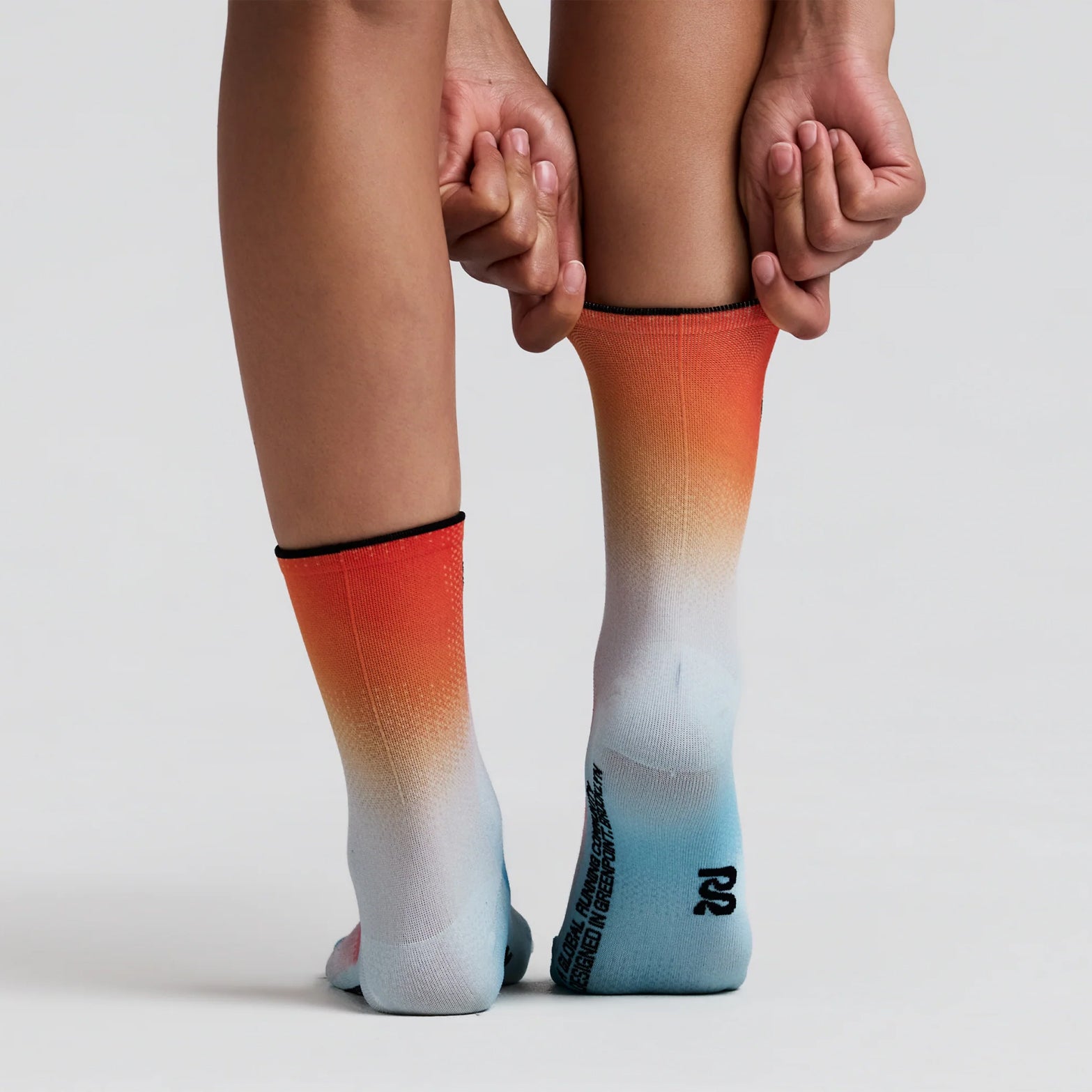 Bandit Lite Run 2 Pack Quarter Socks Lagoon Copal back view on runner showing quarter-length cut with spandex compression fit and ribbed knit Bandit branding at ankle for secure featherweight running performance