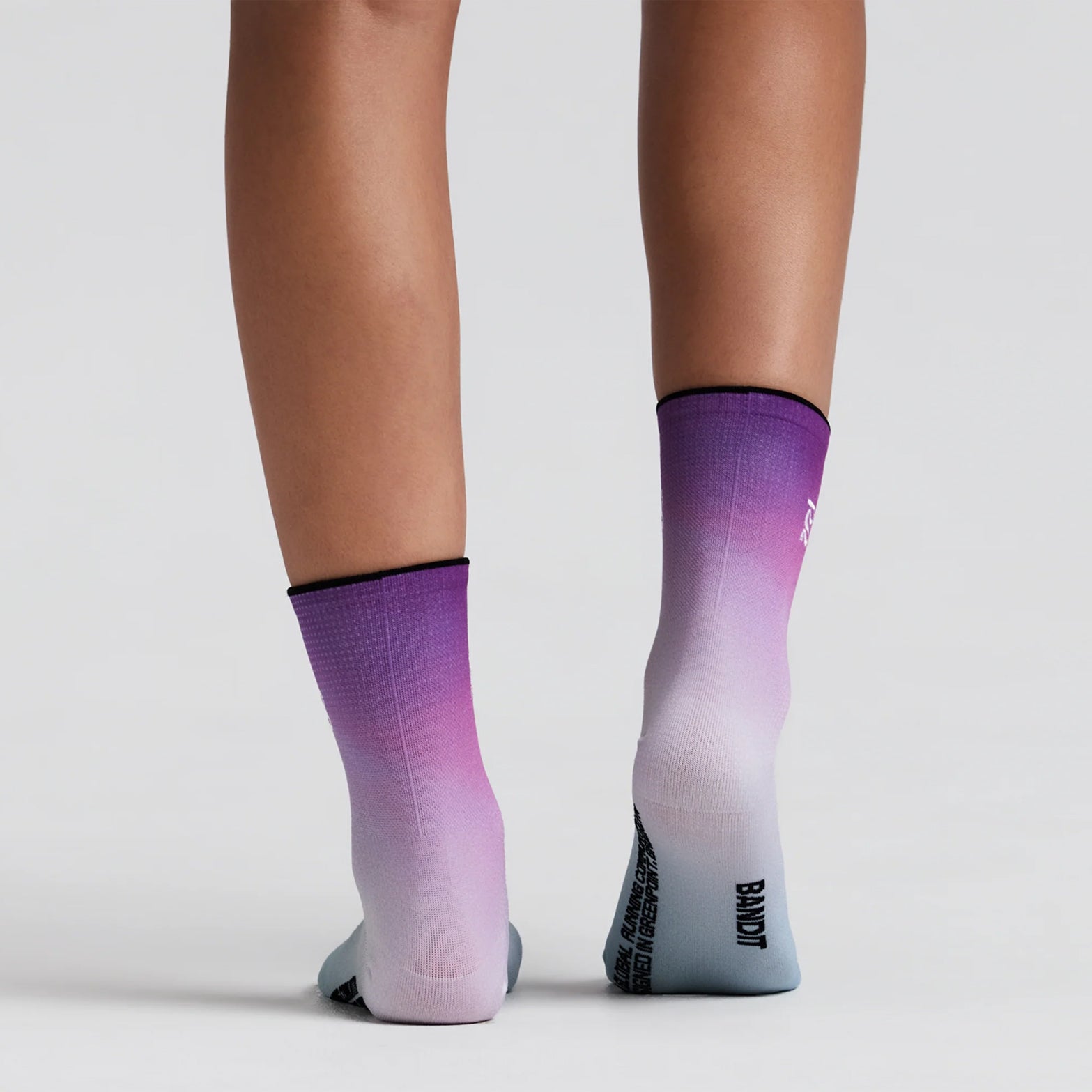 Bandit Lite Run 2 Pack Quarter Socks Orchid Bloom back view on runner showing quarter-length cut with spandex compression fit and ribbed knit Bandit branding at ankle for secure featherweight running performance