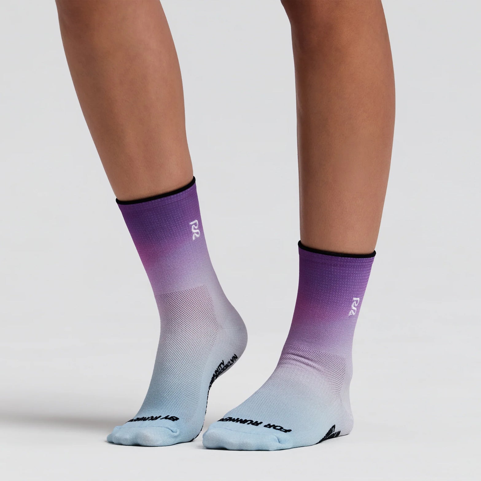 Bandit Lite Run 2 Pack Quarter Socks Orchid Bloom on runner showing quarter-length cut with honeycomb mesh crown and spandex compression for featherweight breathable running performance