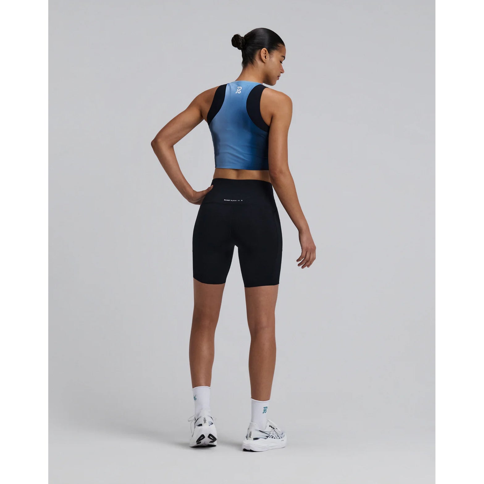 Bandit Lite Run™ Ribbed Quarter Socks in White / Tranquil Blue — full body back view worn on model showing quarter-length cut, ribbed ankle detail and tranquil blue knit Bandit branding with running kit