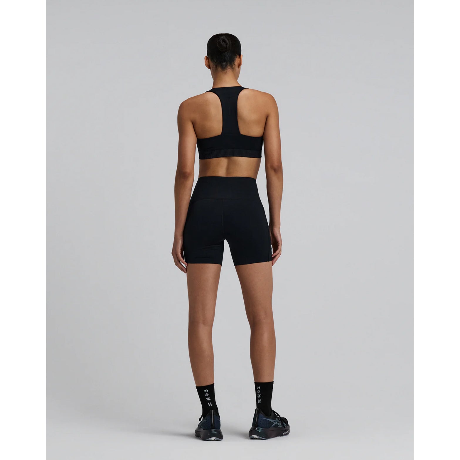 Bandit Lite Run Spring Motif Quarter Socks Black White full body back view on runner showing seasonal motif design with ultra-breathable honeycomb mesh and anti-microbial odourless construction