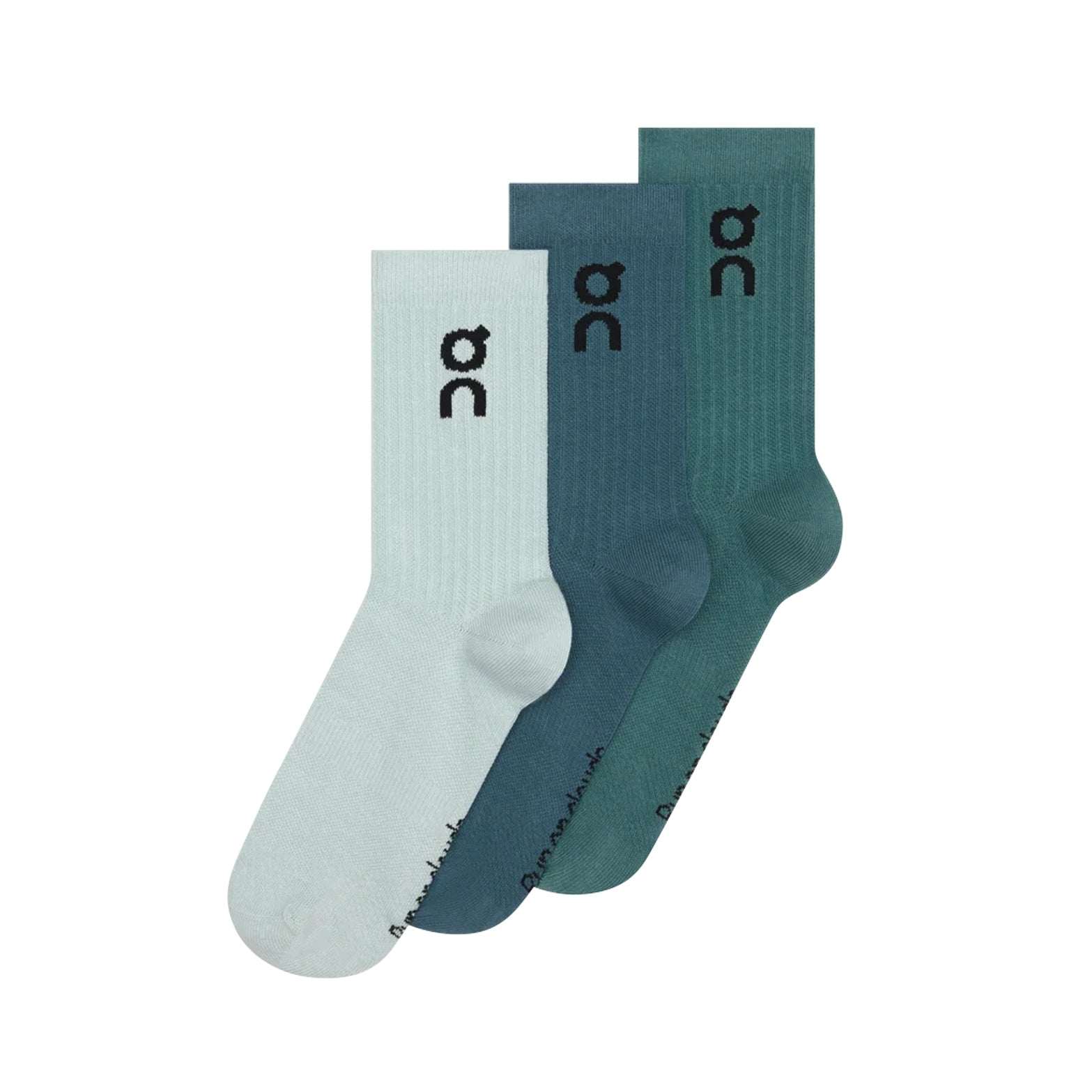 Here is your rewritten sentence using the given product data: The On Logo Socks High 3 Pack in Brook / Storm includes three pairs of crew socks in light blue, teal, and dark teal. Each training sock is detailed with a black On logo near the top and subtle writing by the toe. Designed to deliver both all-day comfort and athletic style, these versatile socks are neatly arranged in an overlapping display.