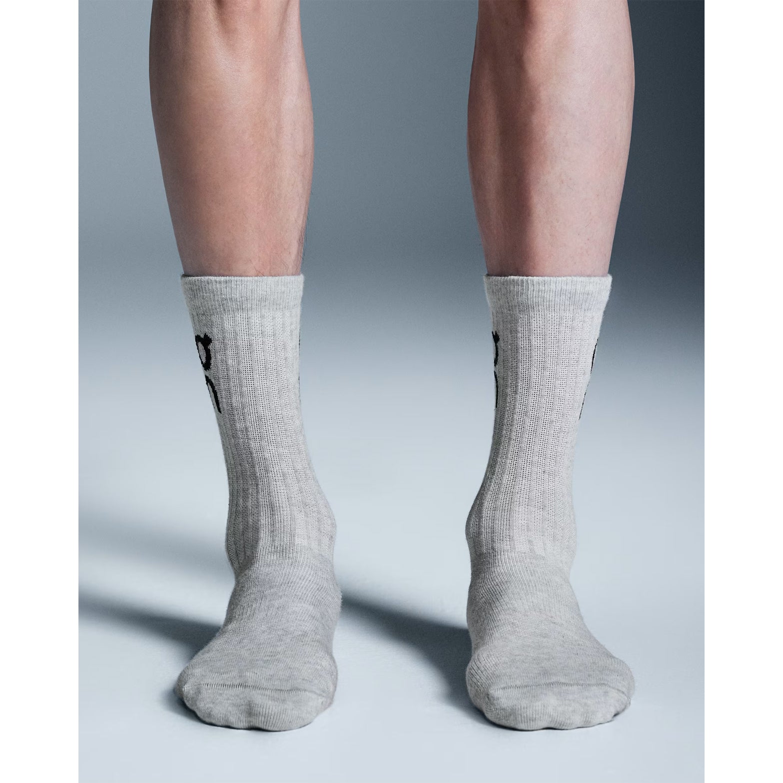 On Logo Socks High Heather Gray front view on model showing ribbed cuf