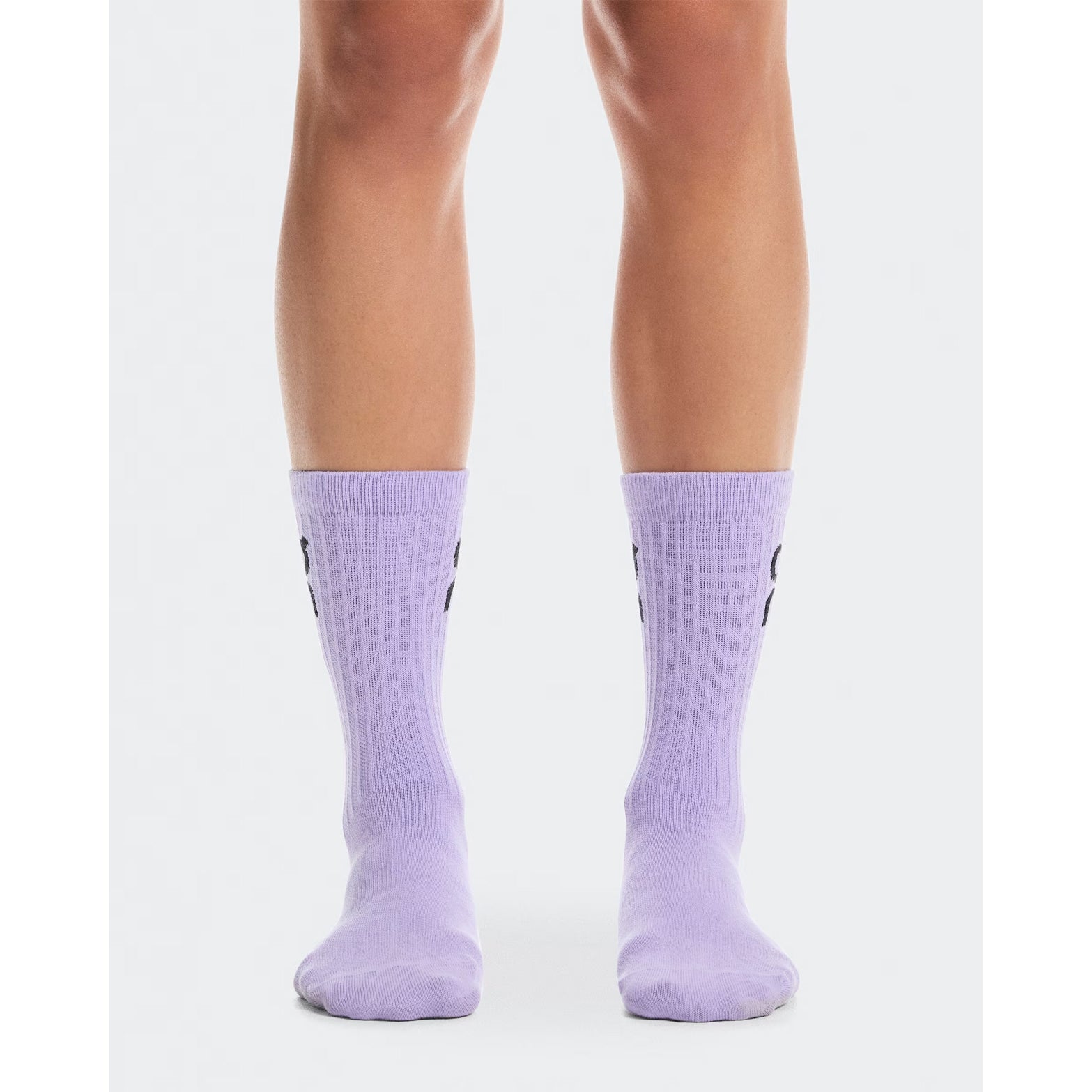 On Logo Socks High 3 Pack Orchid Bloom front view on runner showing high-cut length with rib structure cuff and soft construction for all-day comfort