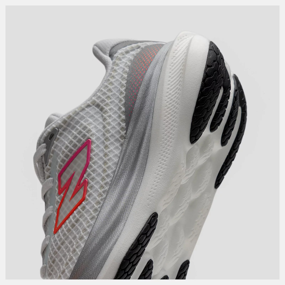 New Balance 1080v15 Breathe men's running shoe in White / Pink Heat / Tangerine Heat — angled side view showing white perforated mesh upper, moulded contour detailing and pink heat and tangerine heat Infinion midsole profile