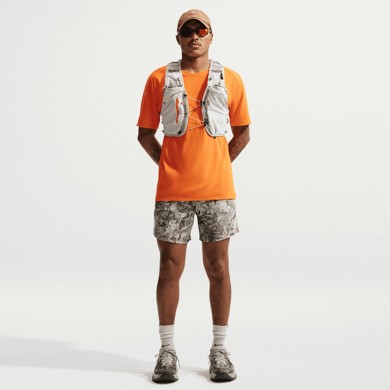 Men's Nike ACG 6 Inch Running Shorts Sequoia Light Army Summit White front full body view on male trail runner showing lightweight breathable construction with four-way stretch panels and Dri-FIT technology for outdoor running and hiking