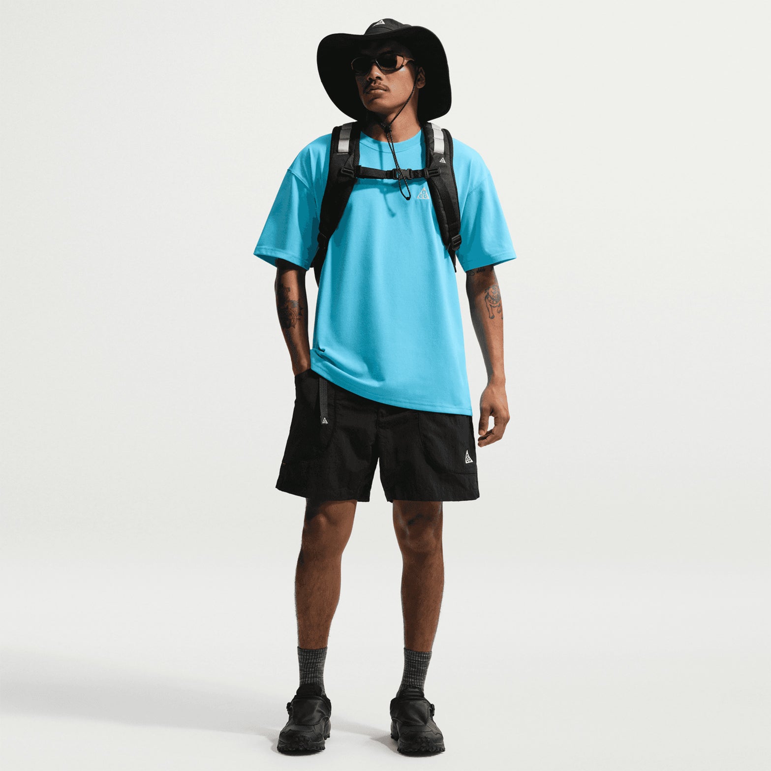 Men's Nike ACG Dolomiti Shorts Black Summit White full body front view on male model showing water-repellent UV-resistant shorts with comfortable loose fit