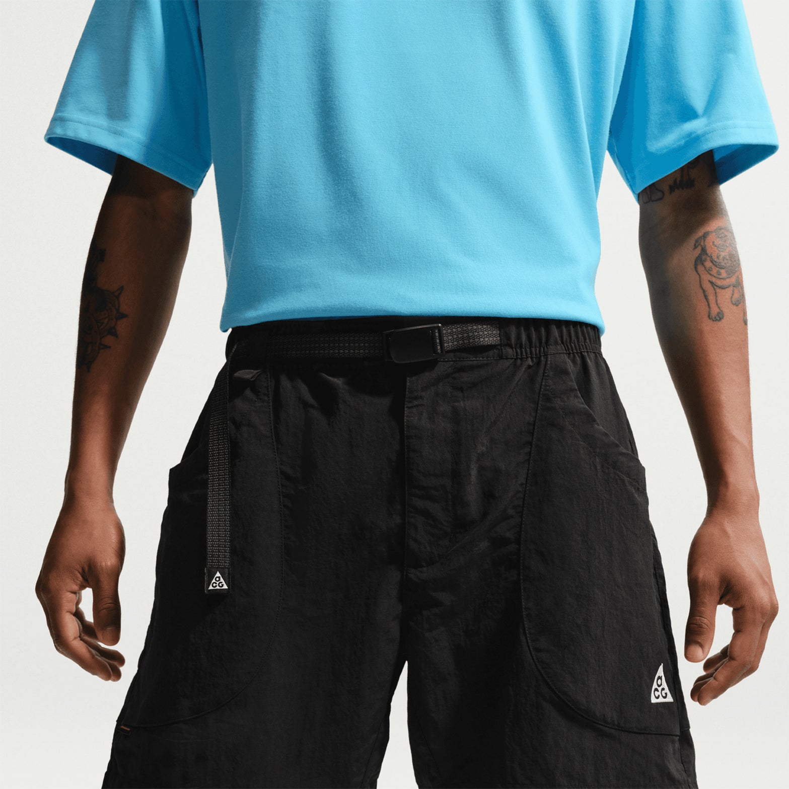 Men's Nike ACG Dolomiti Shorts Black Summit White close-up front showing water-repellent nylon fabric and embroidered ACG logos