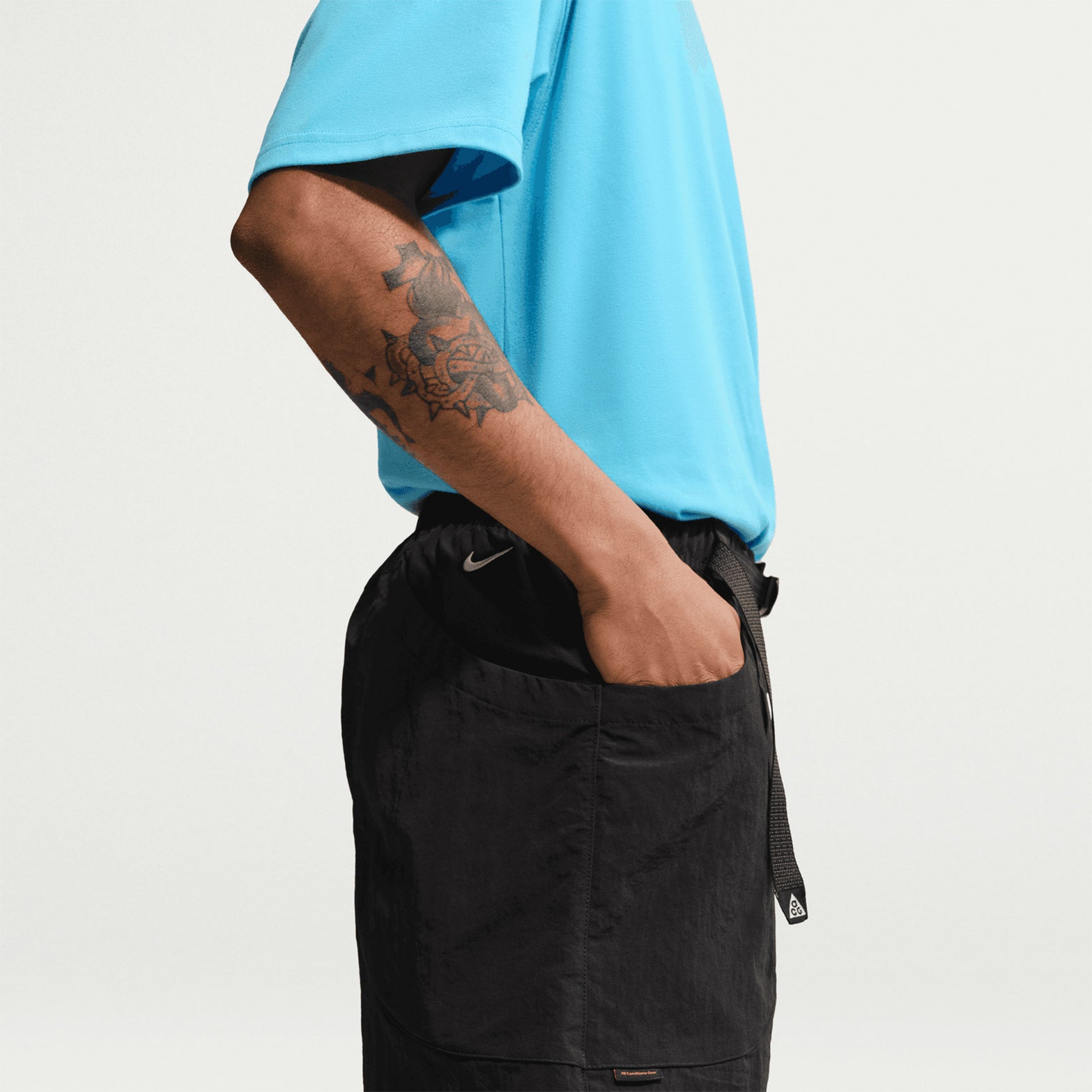 Men's Nike ACG Dolomiti Shorts Black Summit White side close-up showing 100% nylon construction and loose fit design