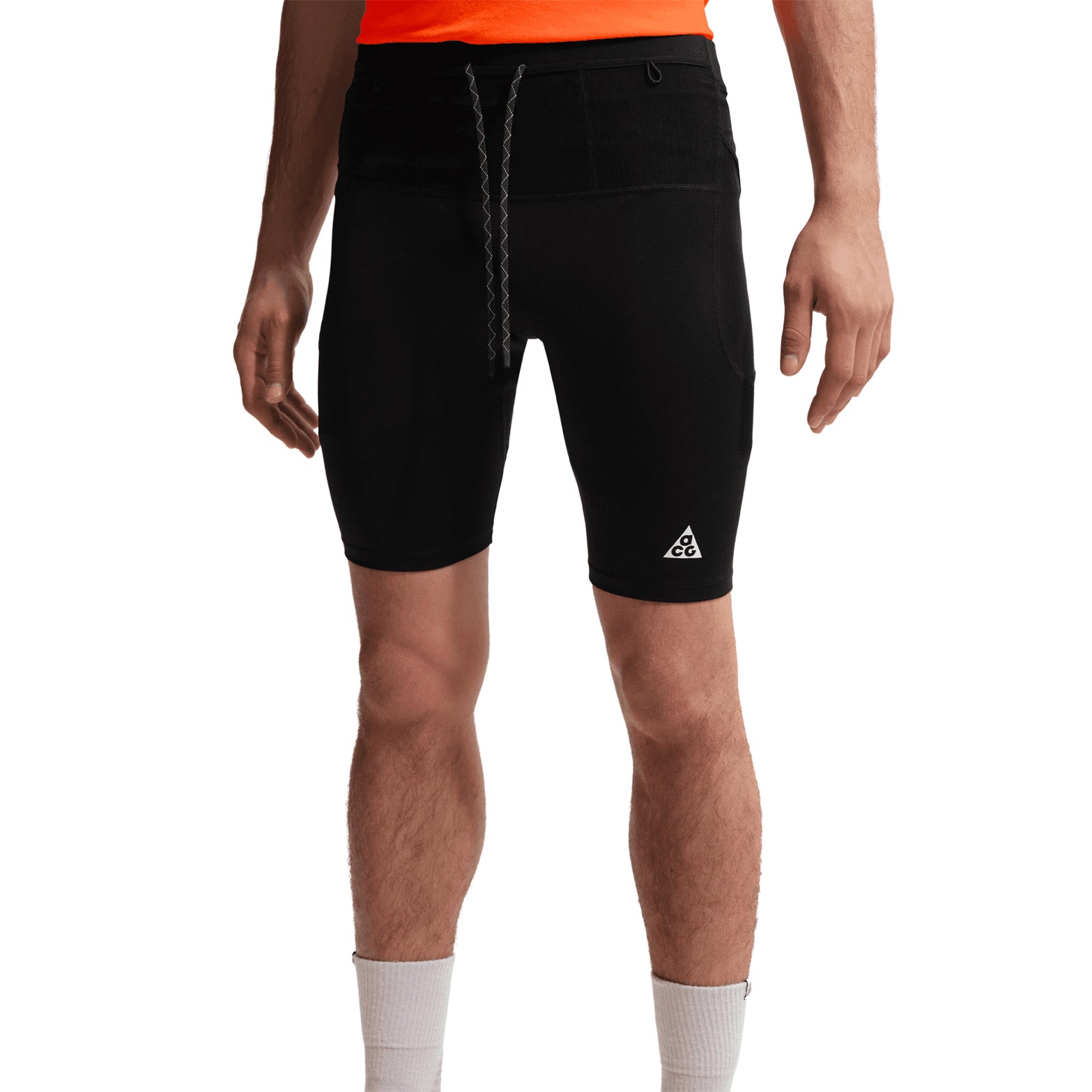 Men's Nike ACG Dri-FIT ADV Half Tights Black Summit White front view on male runner showing snug fit and multiple waistband pockets