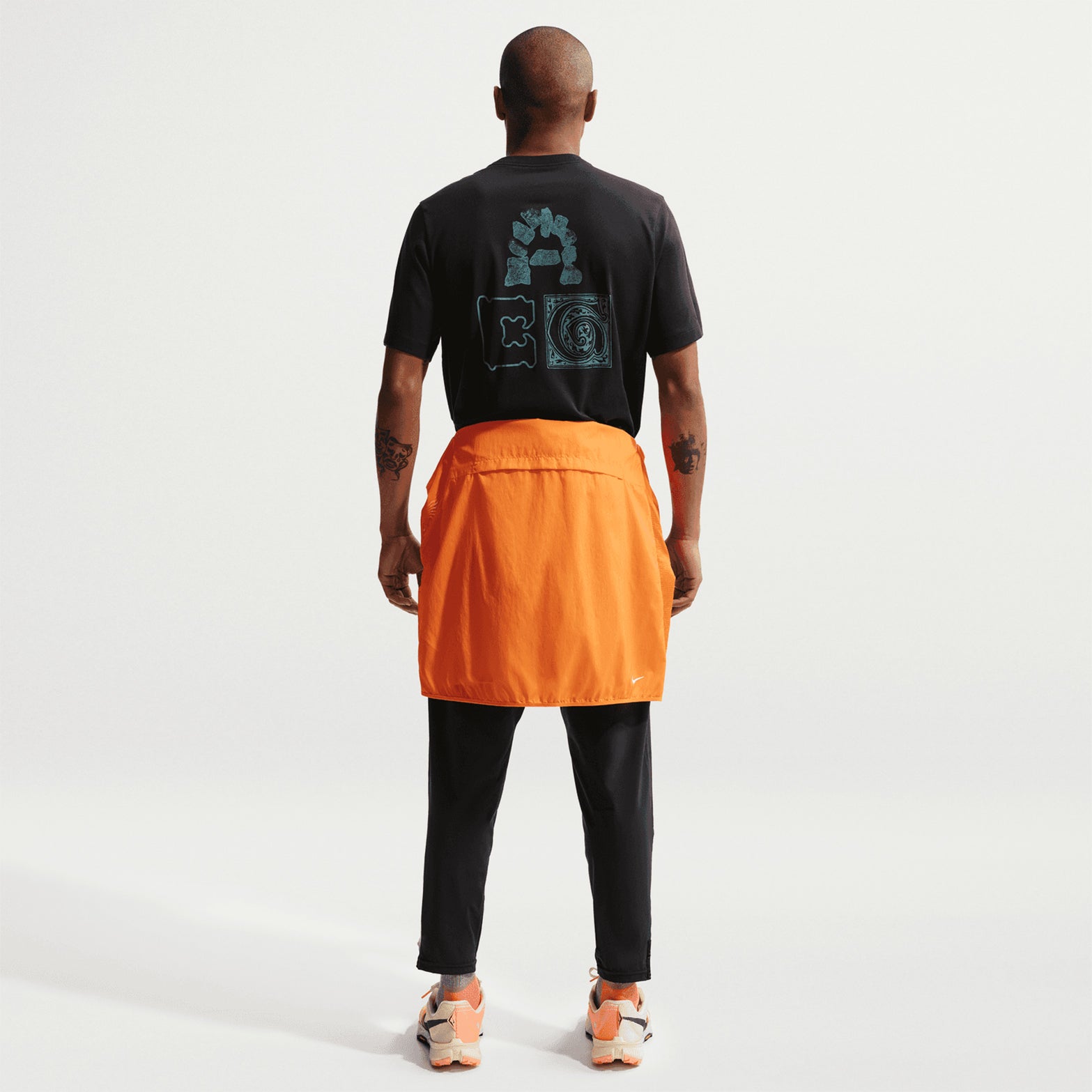 Nike ACG Men's Dri-FIT T-Shirt full body back view on male model showing ACG All Conditions Gear design and cotton-polyester blend fabric