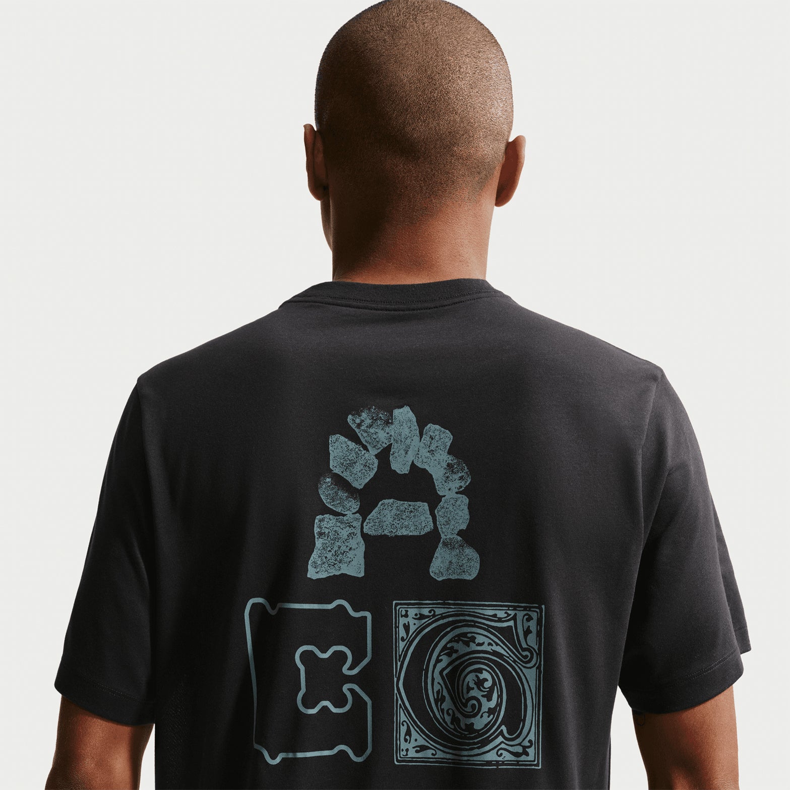 Nike ACG Men's Dri-FIT T-Shirt close-up back showing ACG print details and Dri-FIT technology construction