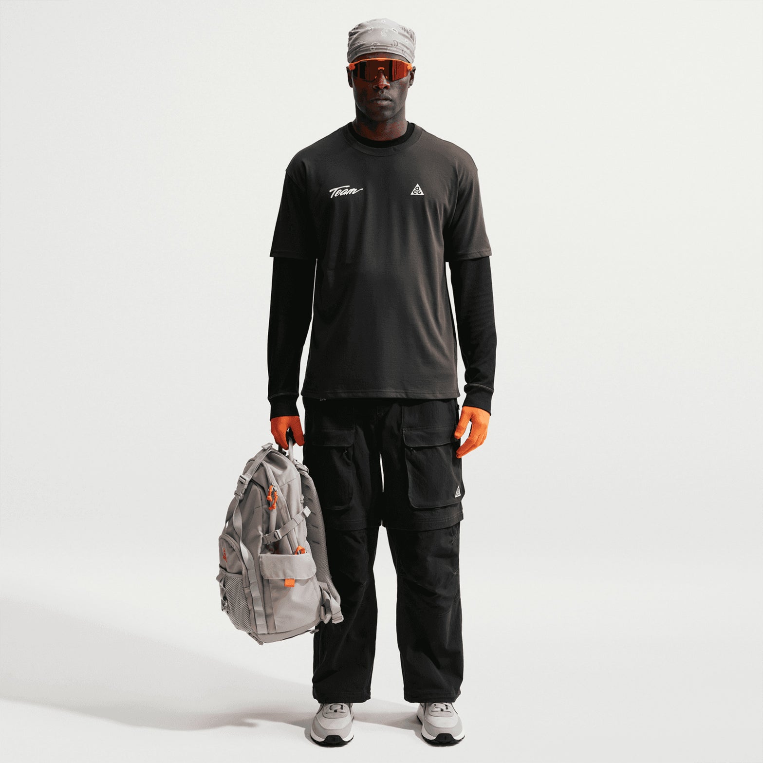 Men's Nike ACG Dri-FIT Tee Dark Smoke Grey front full body view on model showing relaxed fit with Dri-FIT moisture-wicking construction for comfortable training recovery and everyday activities