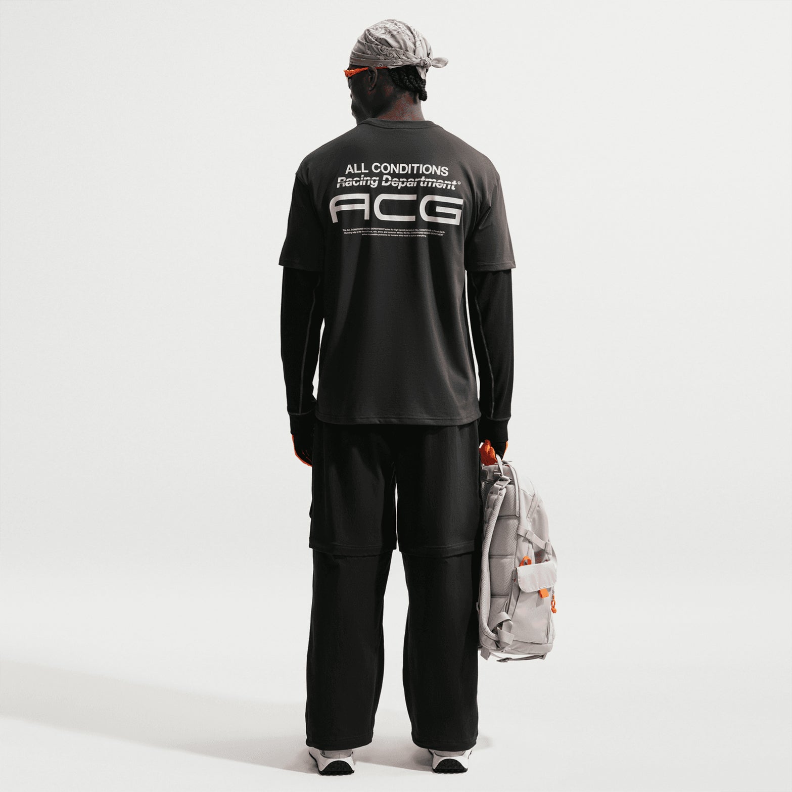 Men's Nike ACG Dri-FIT Tee Dark Smoke Grey back full body view on model showing relaxed cotton-polyester blend construction with Dri-FIT technology for comfortable all-day wear