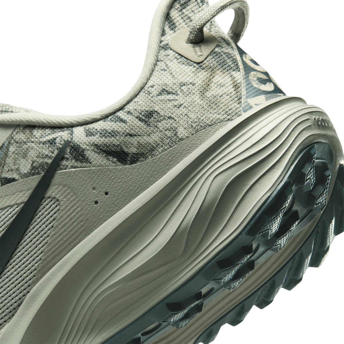 Men's Nike ACG Pegasus Trail Running Shoes Spruce Fog Sea Glass Black Spruce angled side and heel view showing ReactX foam midsole with All Terrain Compound outsole and wider forefoot for road comfort meets trail grip performance