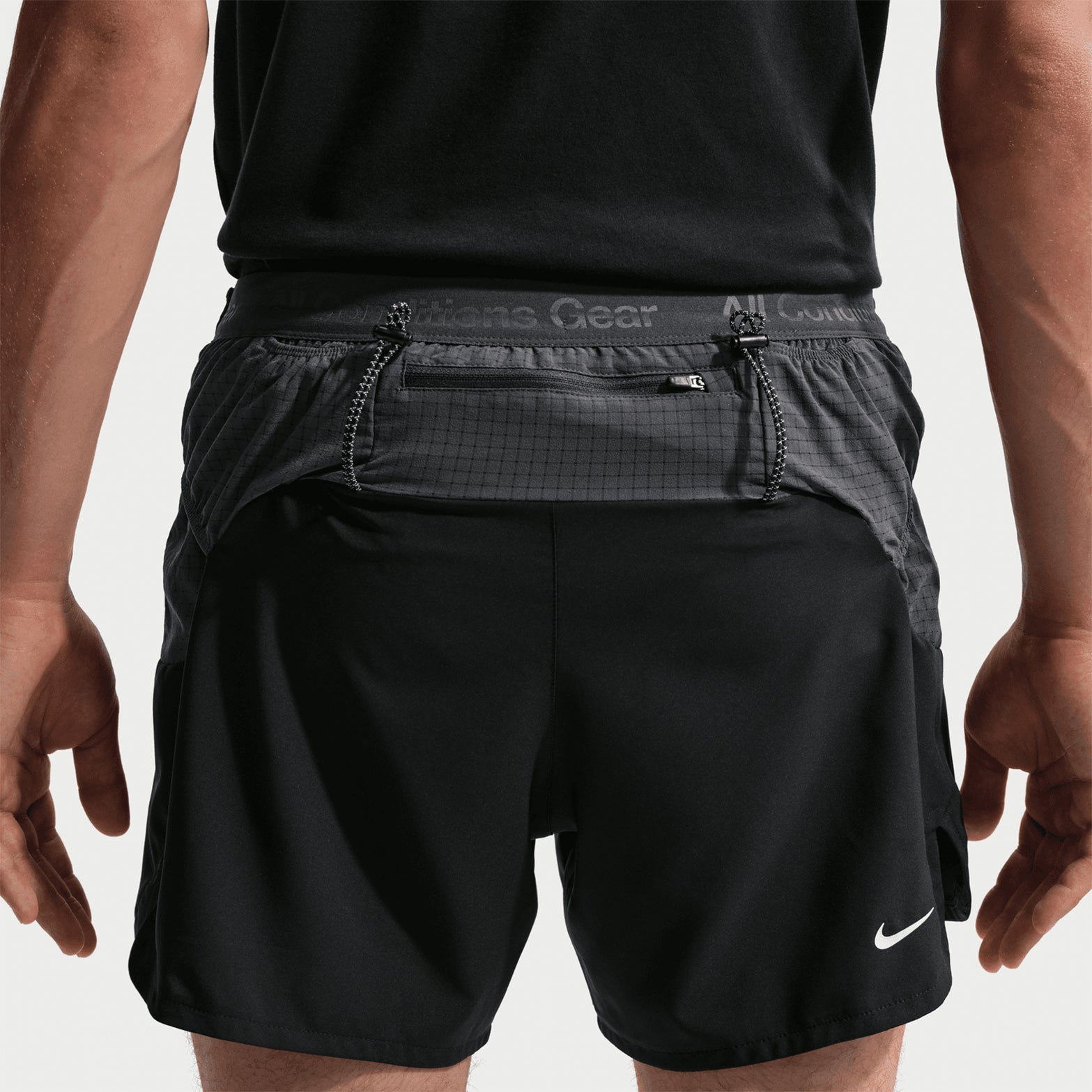 Men's Nike ACG Second Sunrise Dri-FIT 5 Inch Running Shorts Black Anthracite Summit White back view showing zippered phone pocket, back loops for trekking poles and reflective ACG logos