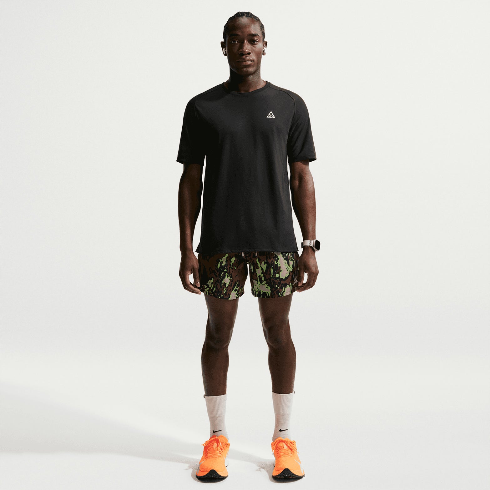 Men's Nike ACG Solar Chase Dri-FIT ADV Trail Running Tee Black Summit White full body view on male trail runner showing lightweight cotton-poly construction with Dri-FIT ADV technology for comfortable outdoor running
