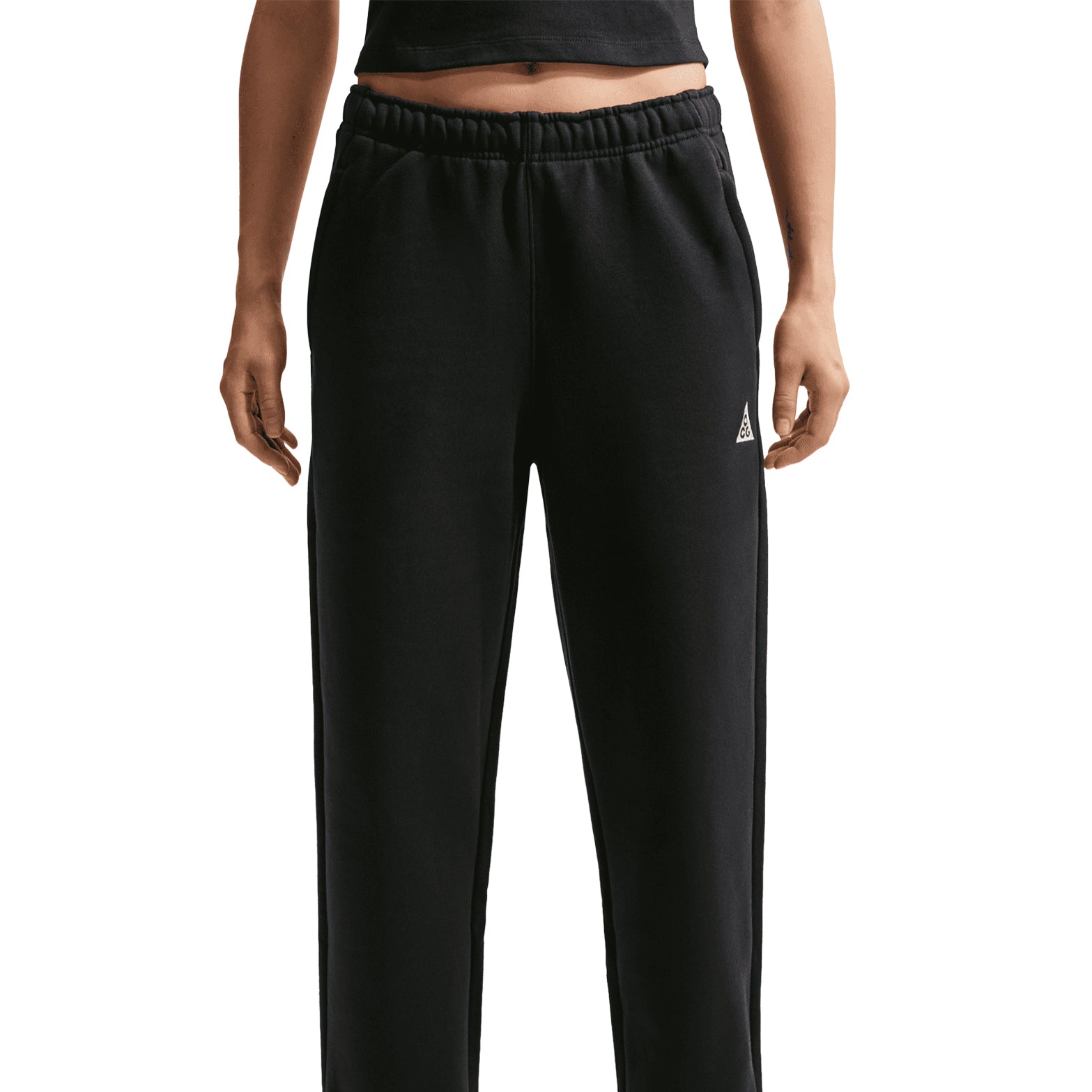 Nike ACG Tuff Fleece trousers in Black / Summit White — front product shot showing black heavyweight fleece construction with summit white detailing, elastic waistband and zippered hand pockets