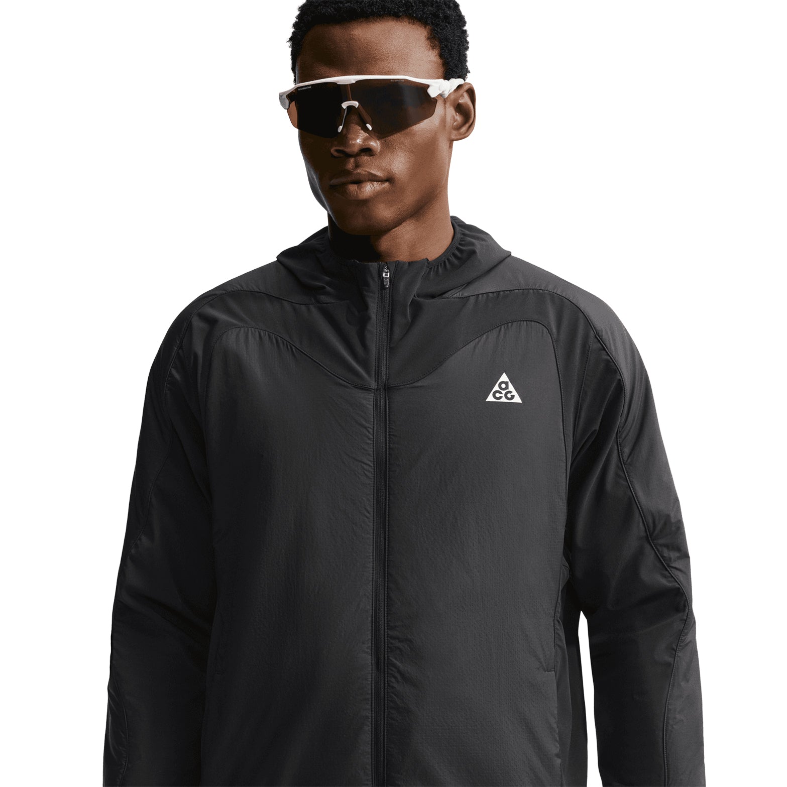 Men's Nike ACG Rope de Dope Jacket Black Summit White front view on male runner showing Therma-FIT ADV heat-regulating construction with bungee drawcord hem and multiple pockets for cold weather outdoor use