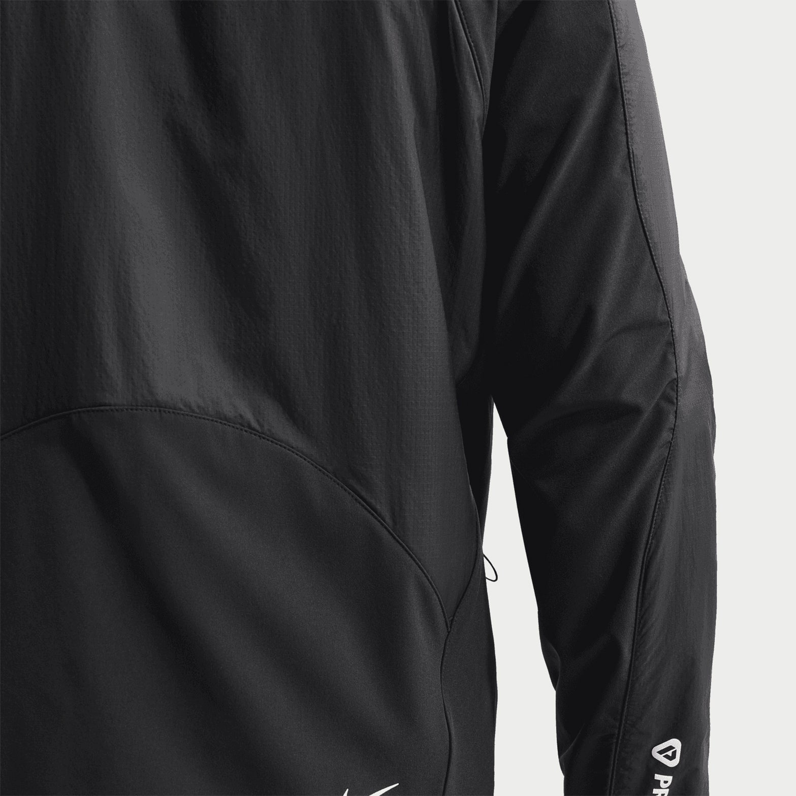 Men's Nike ACG Rope de Dope Jacket Black Summit White back view showing ripstop fabric with stretch-woven panels and reflective details for durable mobile outdoor performance