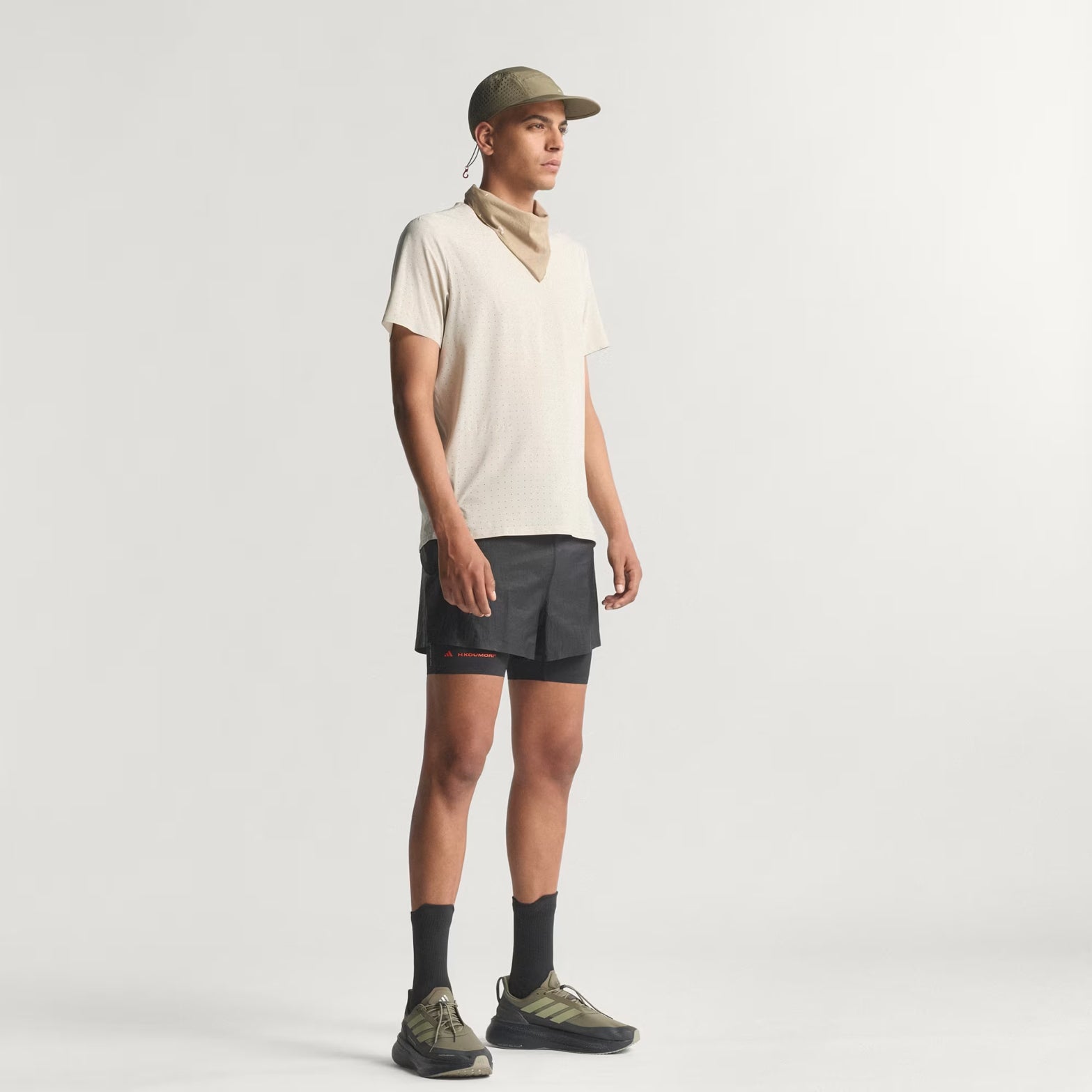 Men's adidas Adi365 H.Koumori Running Tee Putty Grey front full body view on male runner showing UNITEFIT all-gender sizing with comfortable cotton construction for casual running and lifestyle wear