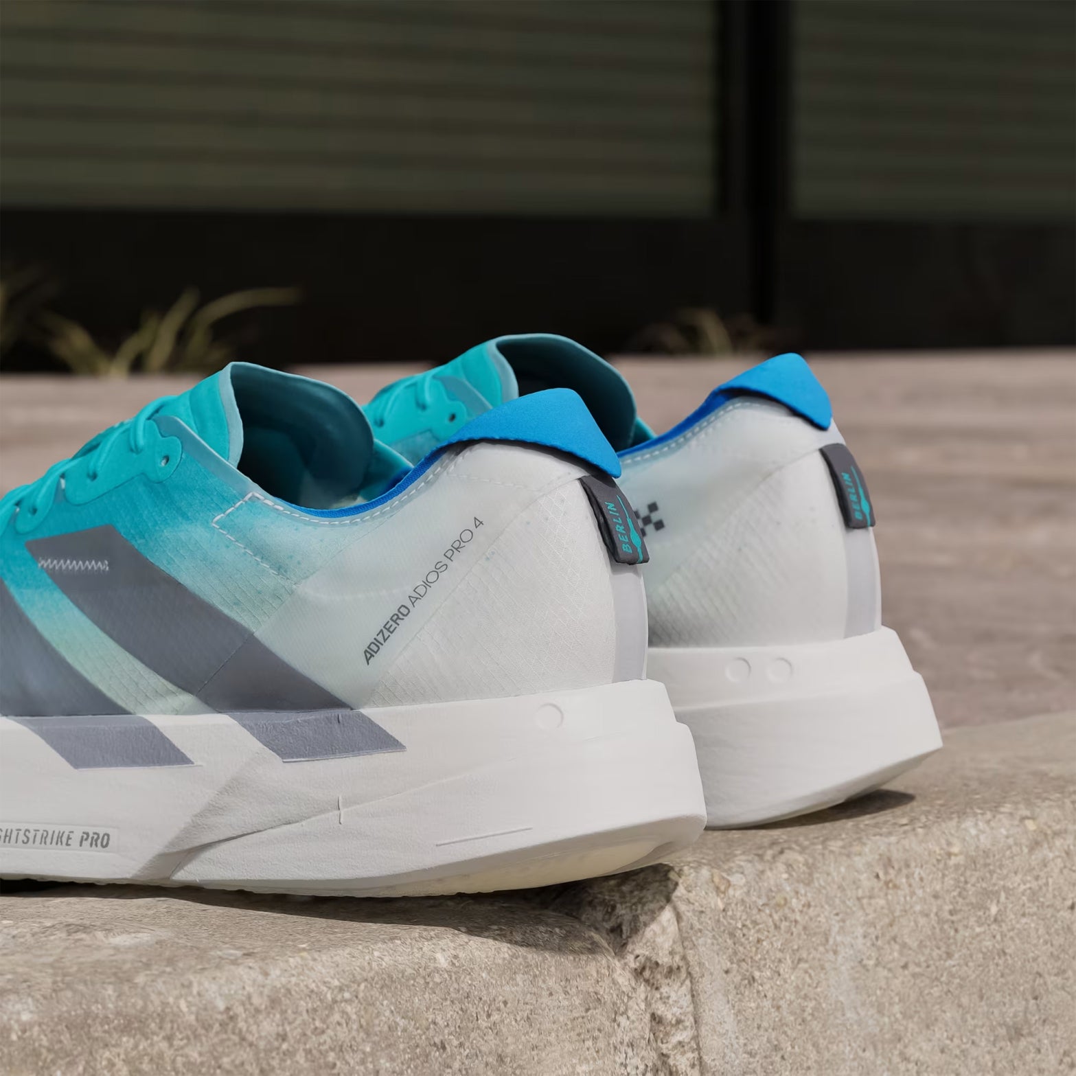 Men's Adizero Adios Pro 4 Running Shoes Hi-Res Aqua Iron Metallic Grey One close-up angled heel view showing heel counter detail