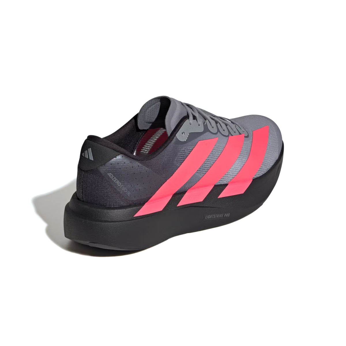 Men’s Adizero EVO SL Running Shoes in Core Black / Solar Turbo / Light Onix, featuring three bright pink stripes and a thick black midsole with LIGHTSTRIKE PRO foam.