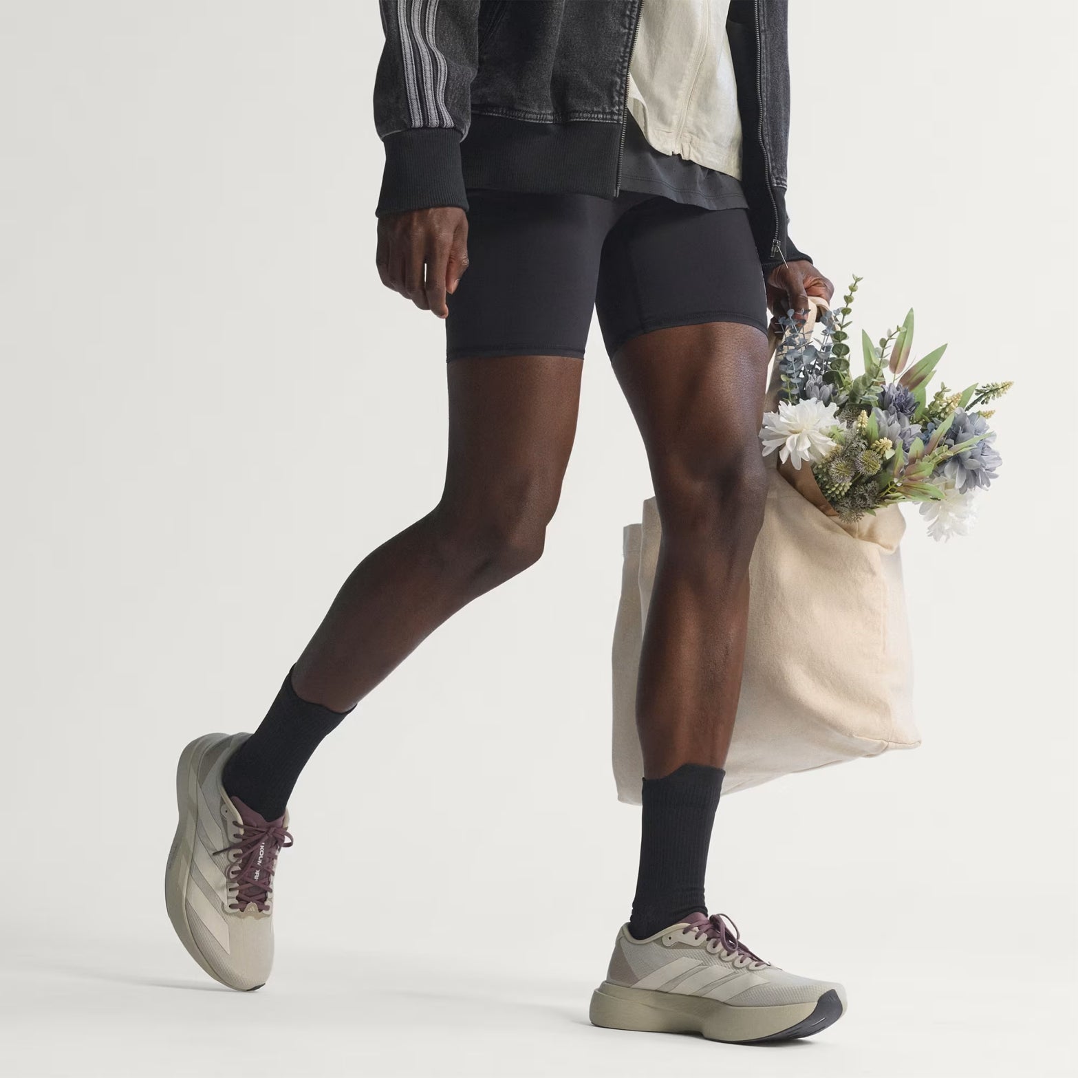 Men's Adizero EVO SL Woven H.Koumori Running Shoes Putty Grey Alumina Shadow Fig close-up of model walking showing natural stride motion