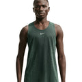 Men's Nike Aero-FIT Running Vest Black Light Green Spark Reflective Silver front view on male runner showing strategic mesh zones with Aero-FIT maximum breathability technology for warm weather running
