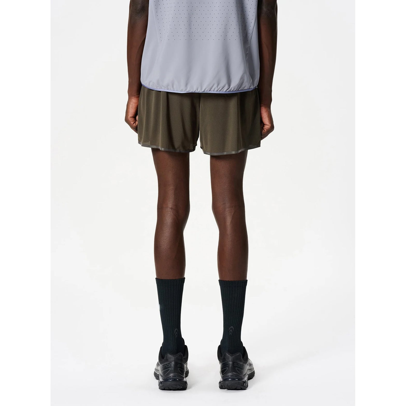 Goldwin Men's Air Pit Storage Shorts Jet Brown back view on male runner showing reflective strips for low-light visibility and mesh construction with integrated compression layer