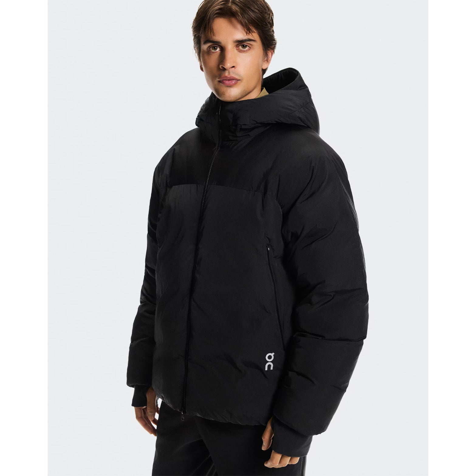 Men's All-Day Puffer Jacket Black front view on model showing adjustable hood and multiple pockets