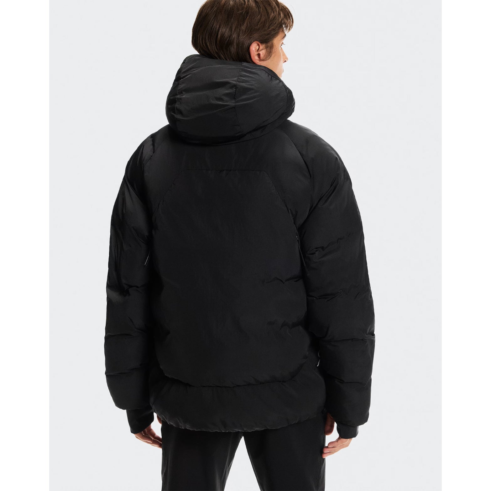 Men's All-Day Puffer Jacket Black back view on model displaying ventilation zippers 