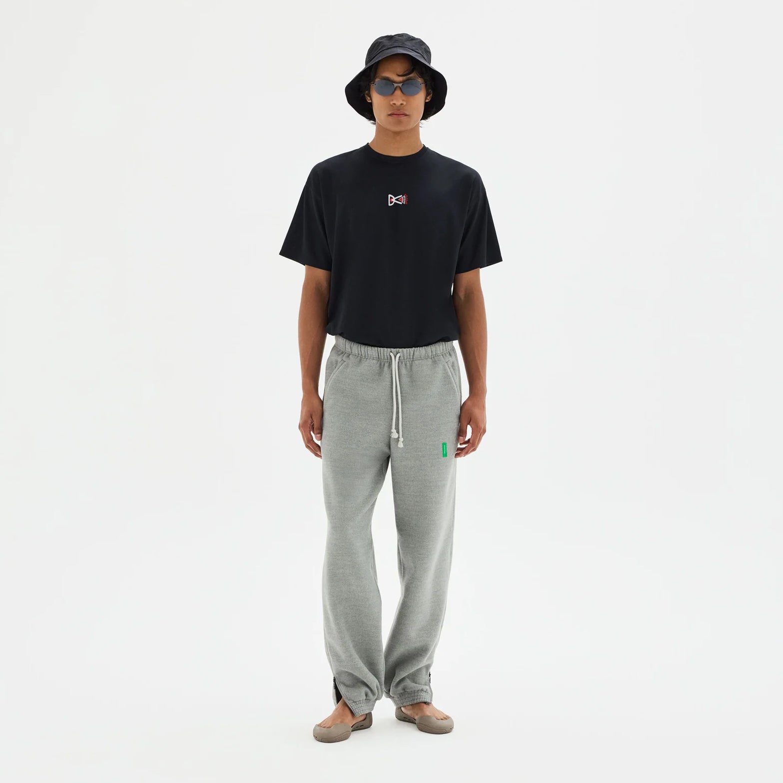 District Vision Men's Boxy Training Tee Black full body view on male runner showing relaxed boxy silhouette with lightweight breathable fabric for running and training