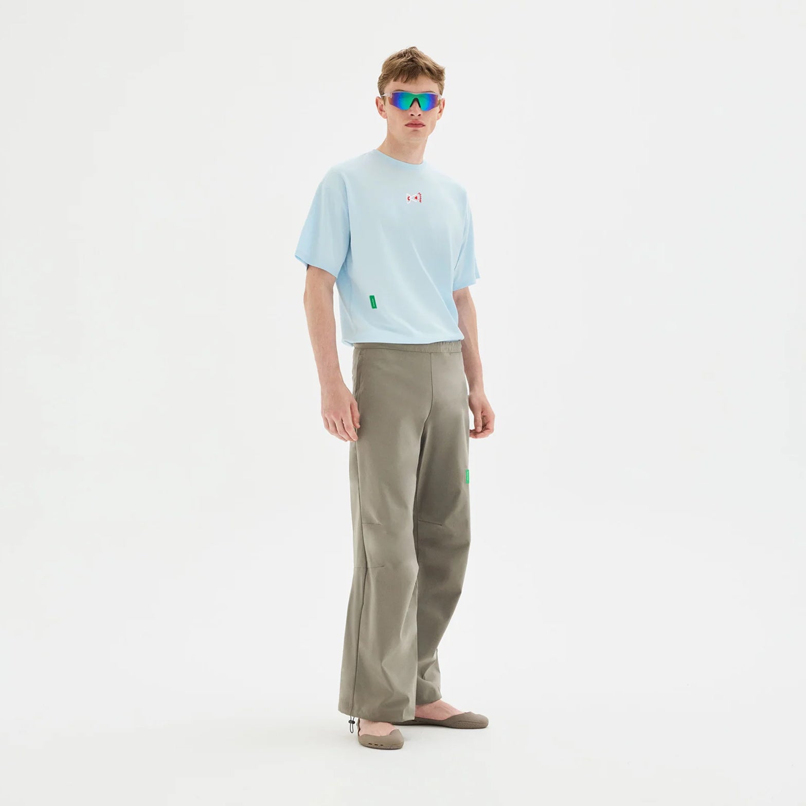 District Vision Men's Boxy Training Tee Frost full body view on male model showing relaxed boxy silhouette with lightweight breathable fabric for running and training